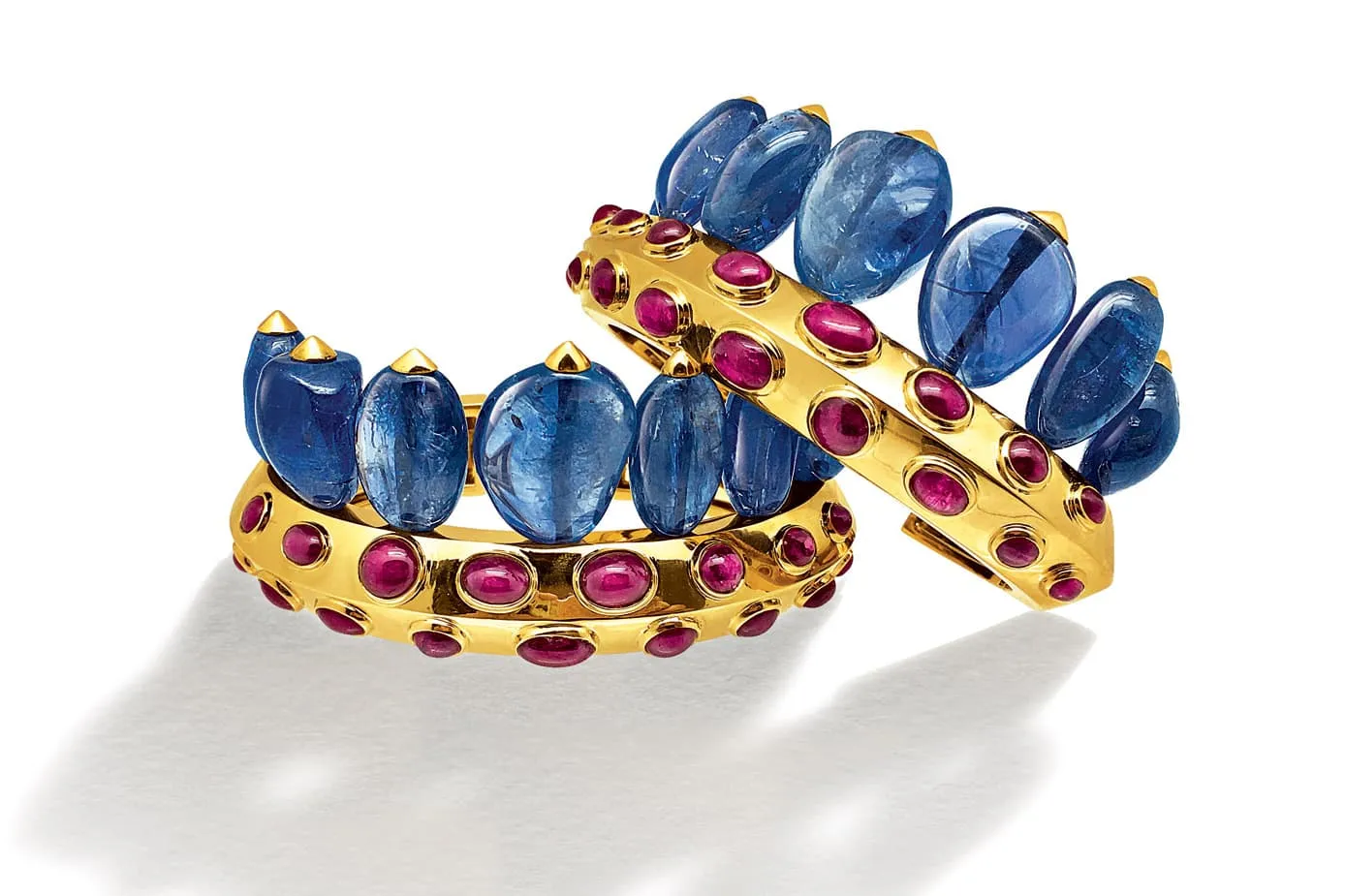 Suzanne Belperron Couronne cuffs with sapphire and ruby cabochons in yellow gold