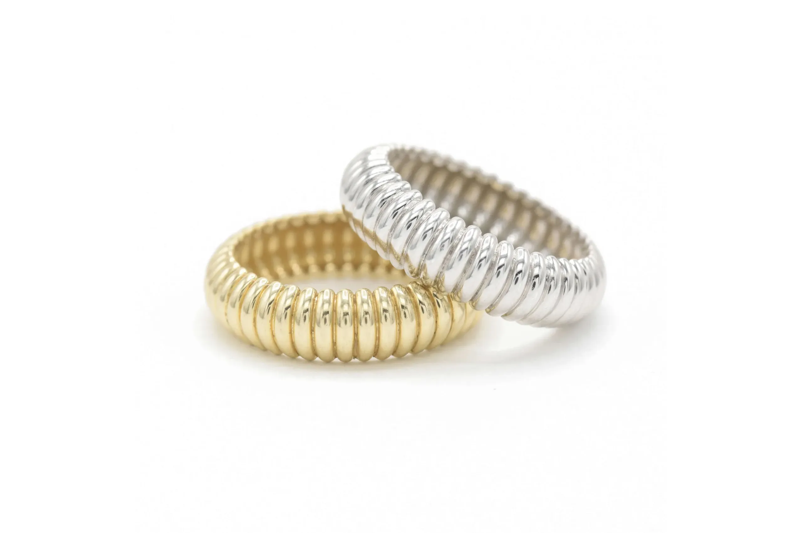 A twist on a classic band-style promise ring: Bondeye puff rings in 14K yellow or white gold.