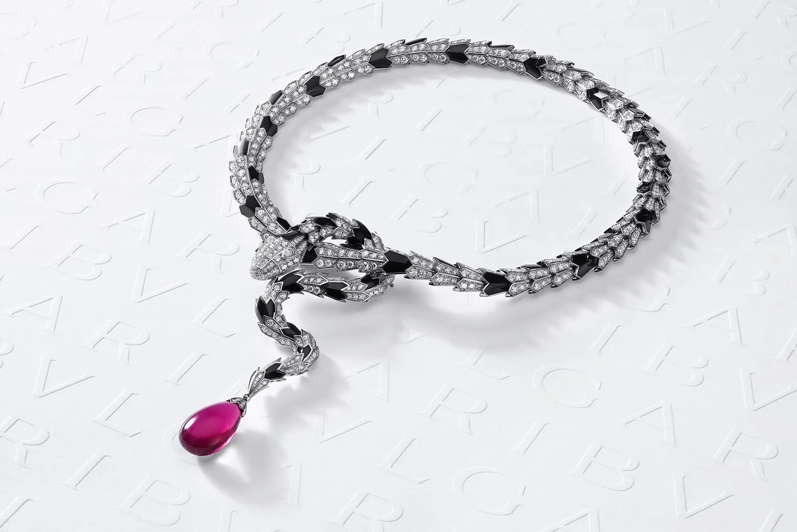 Model Lily Cole wears the Serpenti Metamorphosis High Jewellery necklace with a 21 carat rubellite drop from the Bulgari Magnifica collection