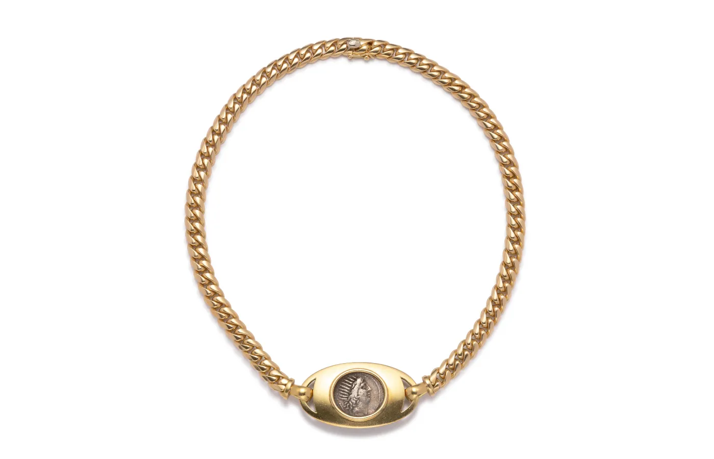 Vintage Bvlgari Monete necklace, circa 1970, decorated with a Roman coin depicting Claudius, who became emperor of Rome in 41 AD. Available at Véronique Bamps.