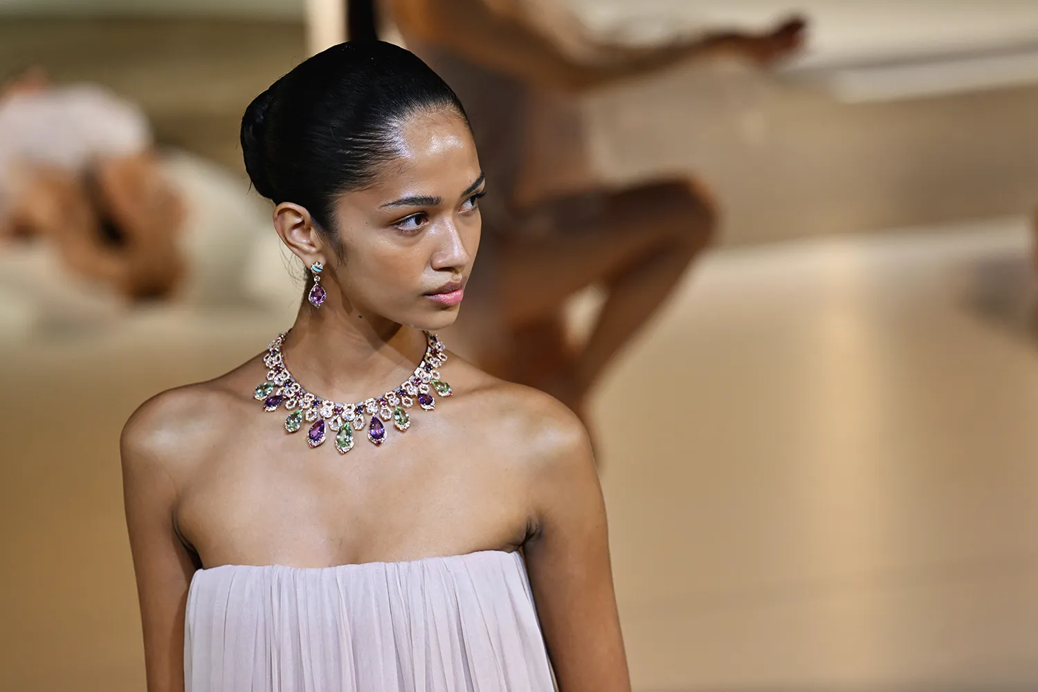 A model wears a necklace from the Bvlgari Polychroma High Jewellery collection at the Greek Theatre in Taormina