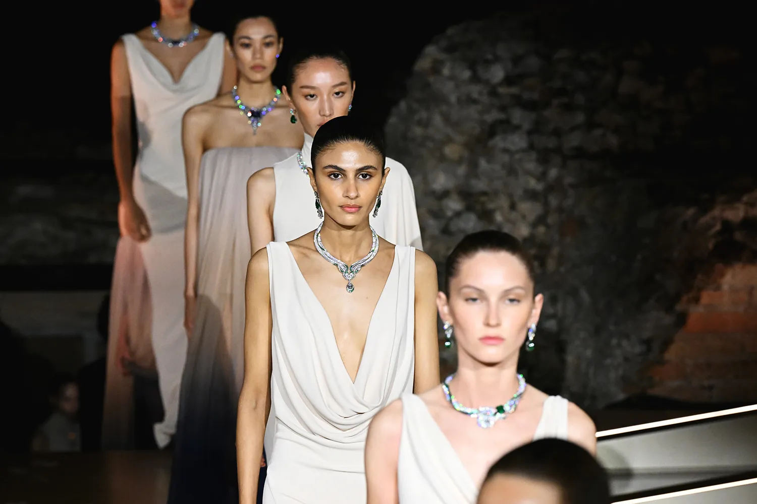  Models showcase pieces from the Bvlgari Polychroma High Jewellery collection at the Greek Theatre in Taormina
