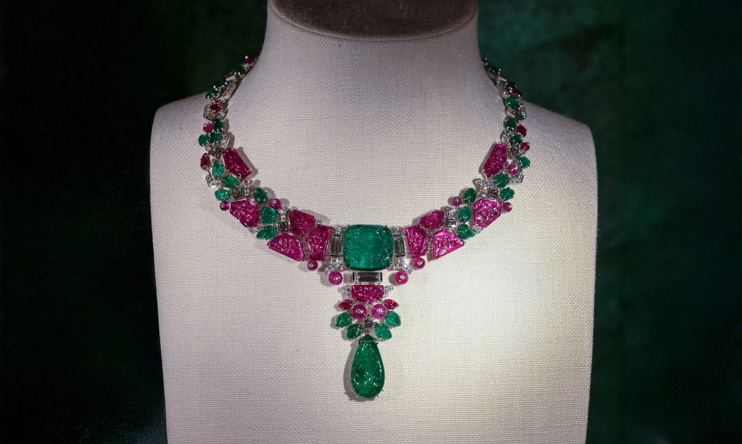 Cartier necklace with a 29.32-carat carved emerald, an 18.30-carat pear-shaped carved emerald, sapphires, rubies and diamonds set in platinum, part of the En Équilibre High Jewellery collection
