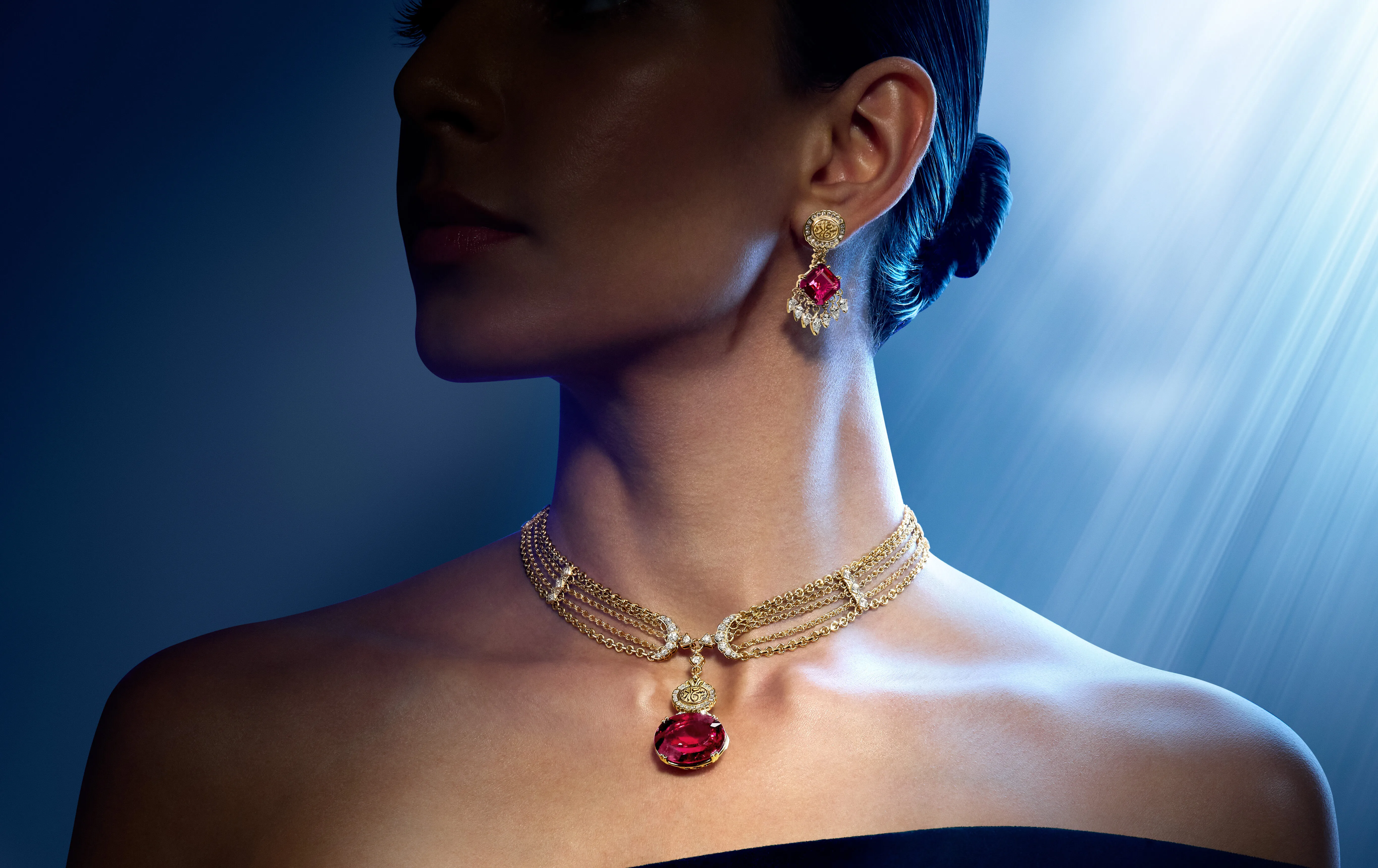 A model wears the Azza Fahmy Chains of Happiness necklace from the second chapter of the Tales of the Nile High Jewellery collection, set with a 26.18-carat rubellite, round brilliant-cut diamonds, and calligraphy that translates to ‘happiness’, alongside the matching earrings with 12.8-carat octagon-cut rubellites 