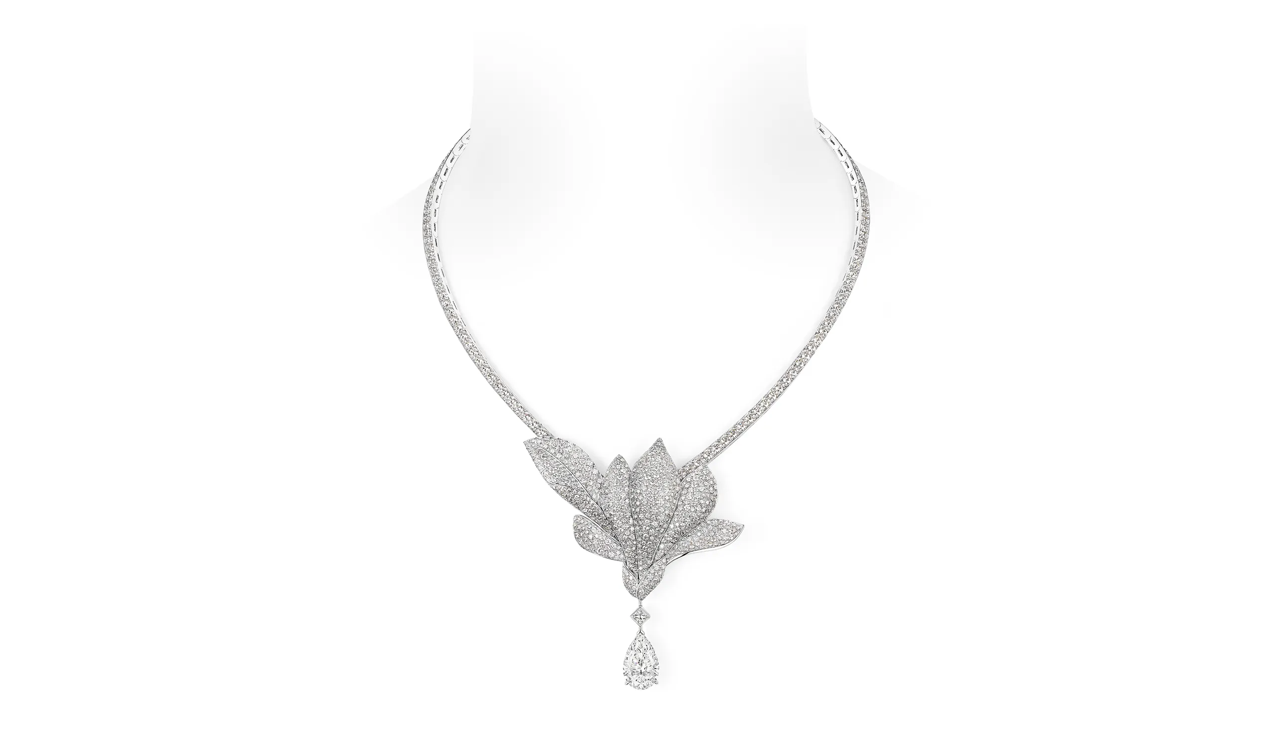A minimalist bloom punctuates the neckline of the Magnolia Grandiflora necklace, with a remarkable 5.26-carat D Flawless type II pear shape diamond suspended beneath