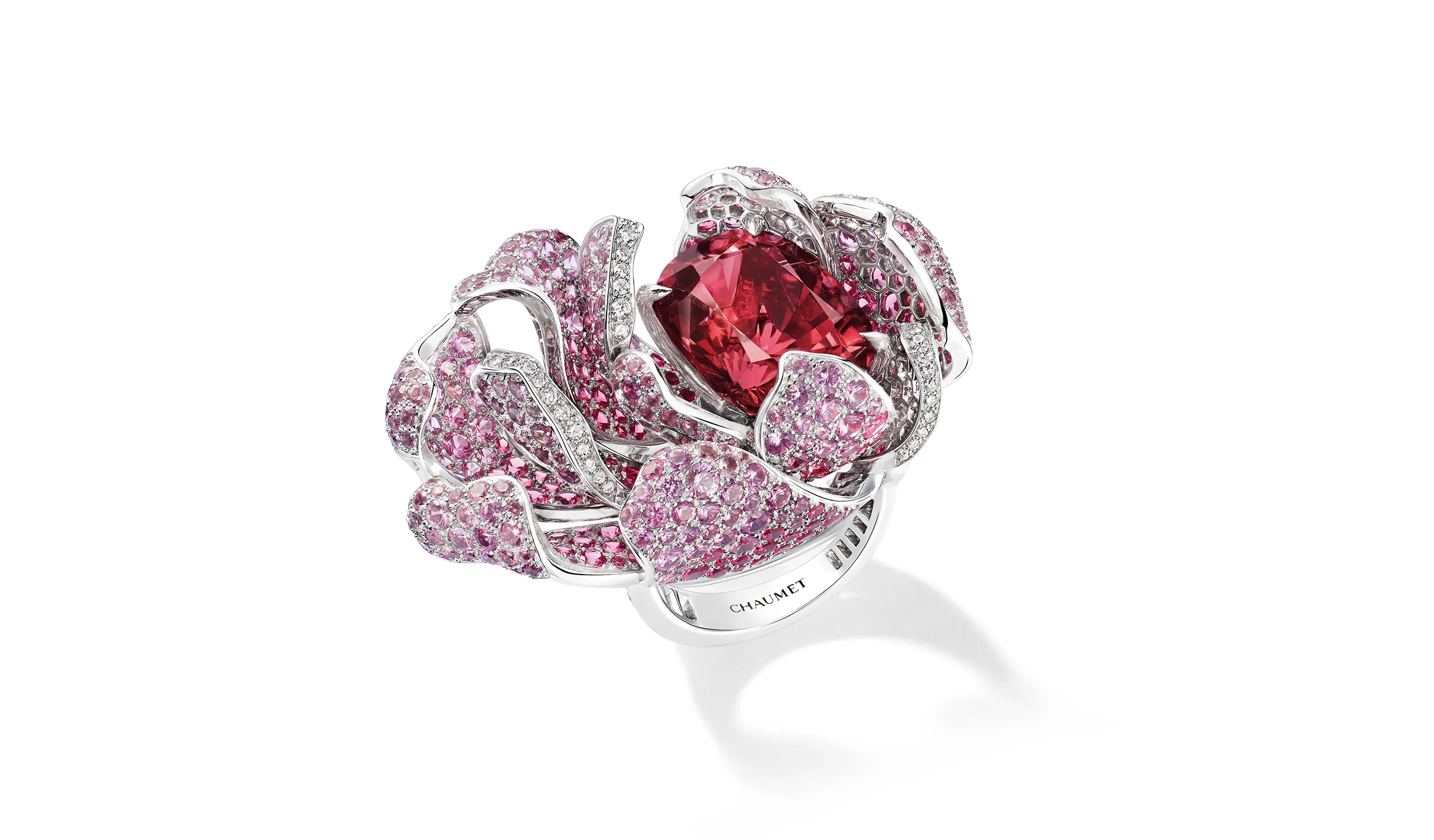 The matching Sweetshrub ring cradles a 20.04 carat rubellite in a swirl of lush, curled petals