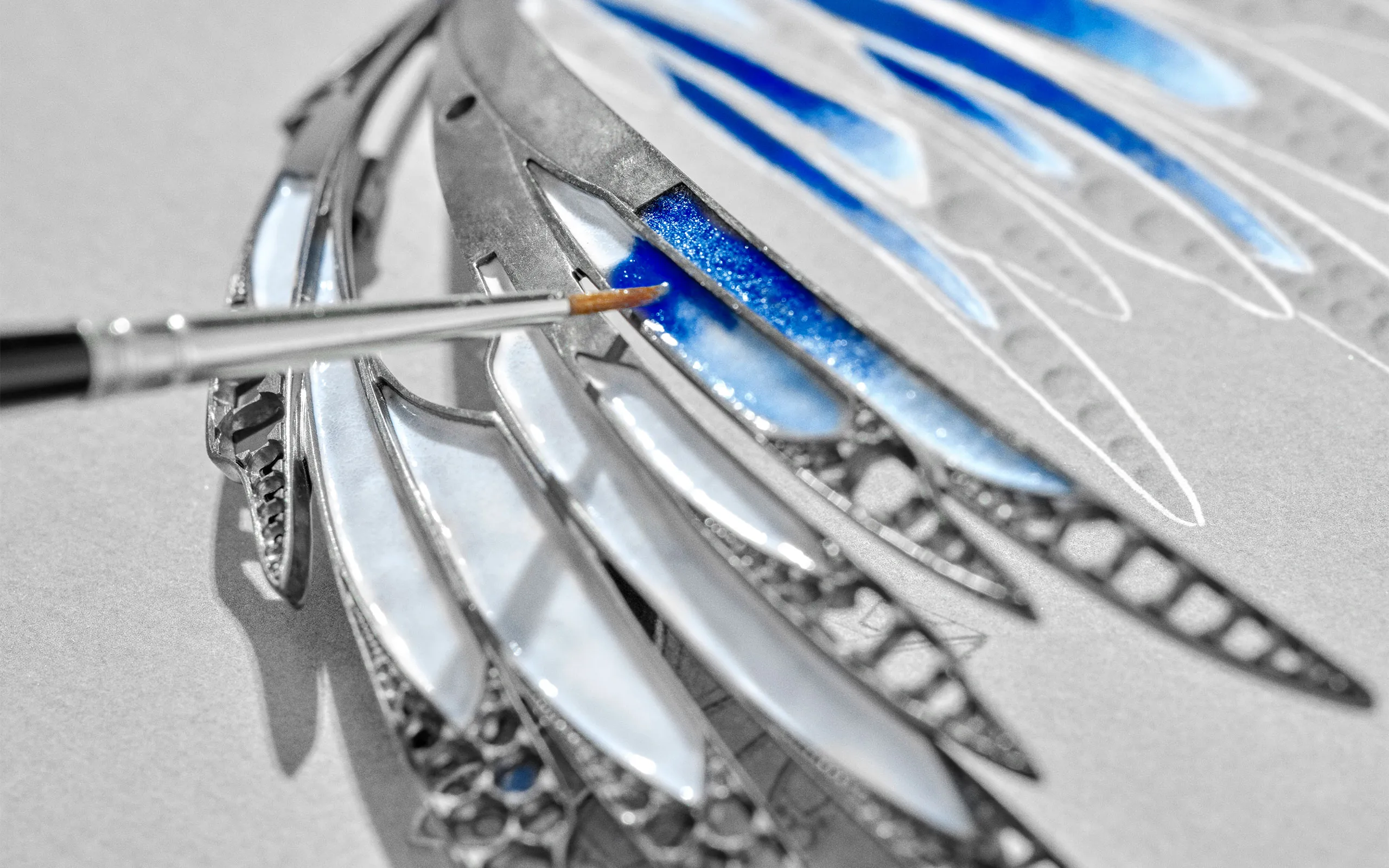 <p>The contrasting dégradé of blues are hand-painted in grand feu enamel</p>