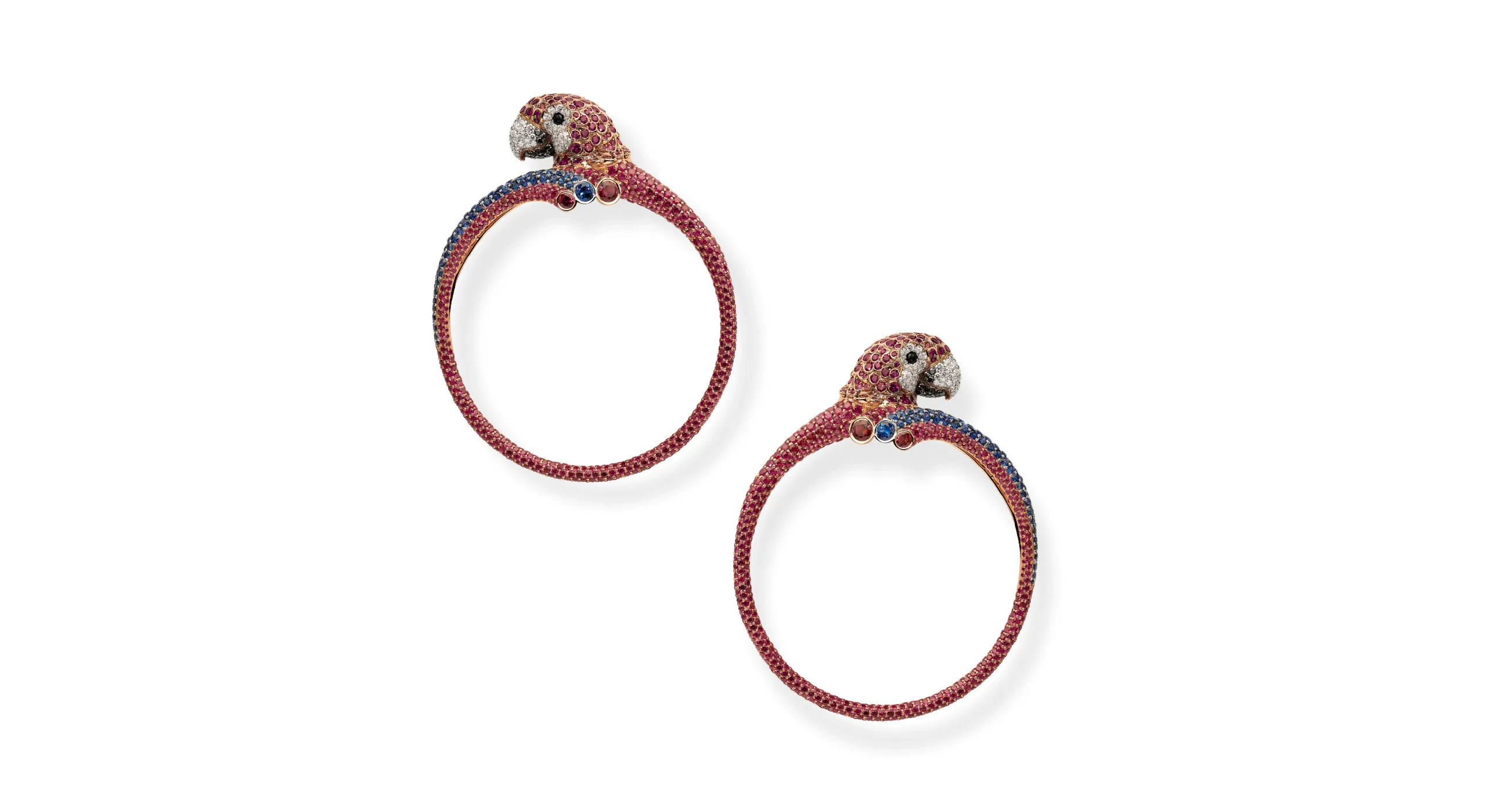 Chopard Parrot earrings with 11.32 carats of brilliant-cut rubies, 1.84 carats of sapphire, as well as black and white diamonds and onyx cabochons, set in 18k white and rose gold, part of the Caroline's Universe Red Carpet High Jewellery Collection 2025
