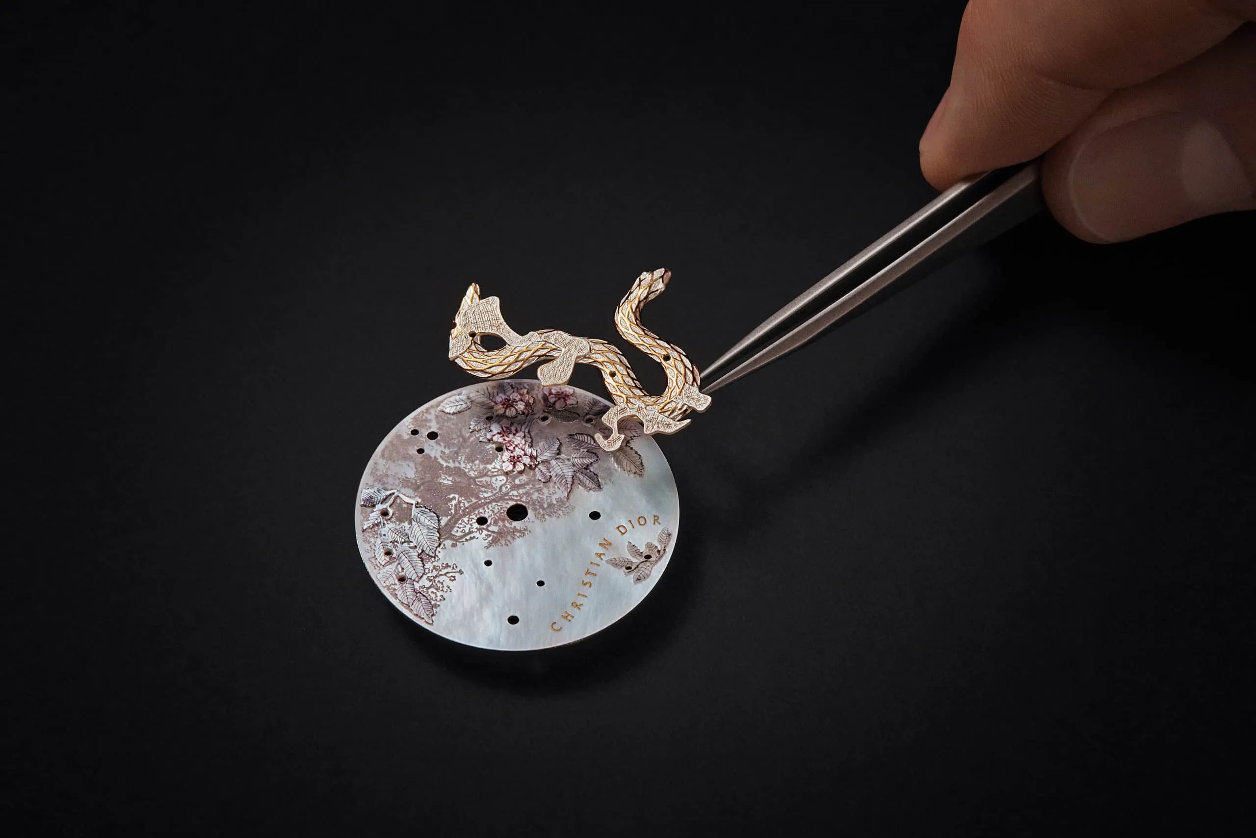 A snake with rose gold scales features prominently on the dial of the Dior Grand Soir Year of the Snake watch