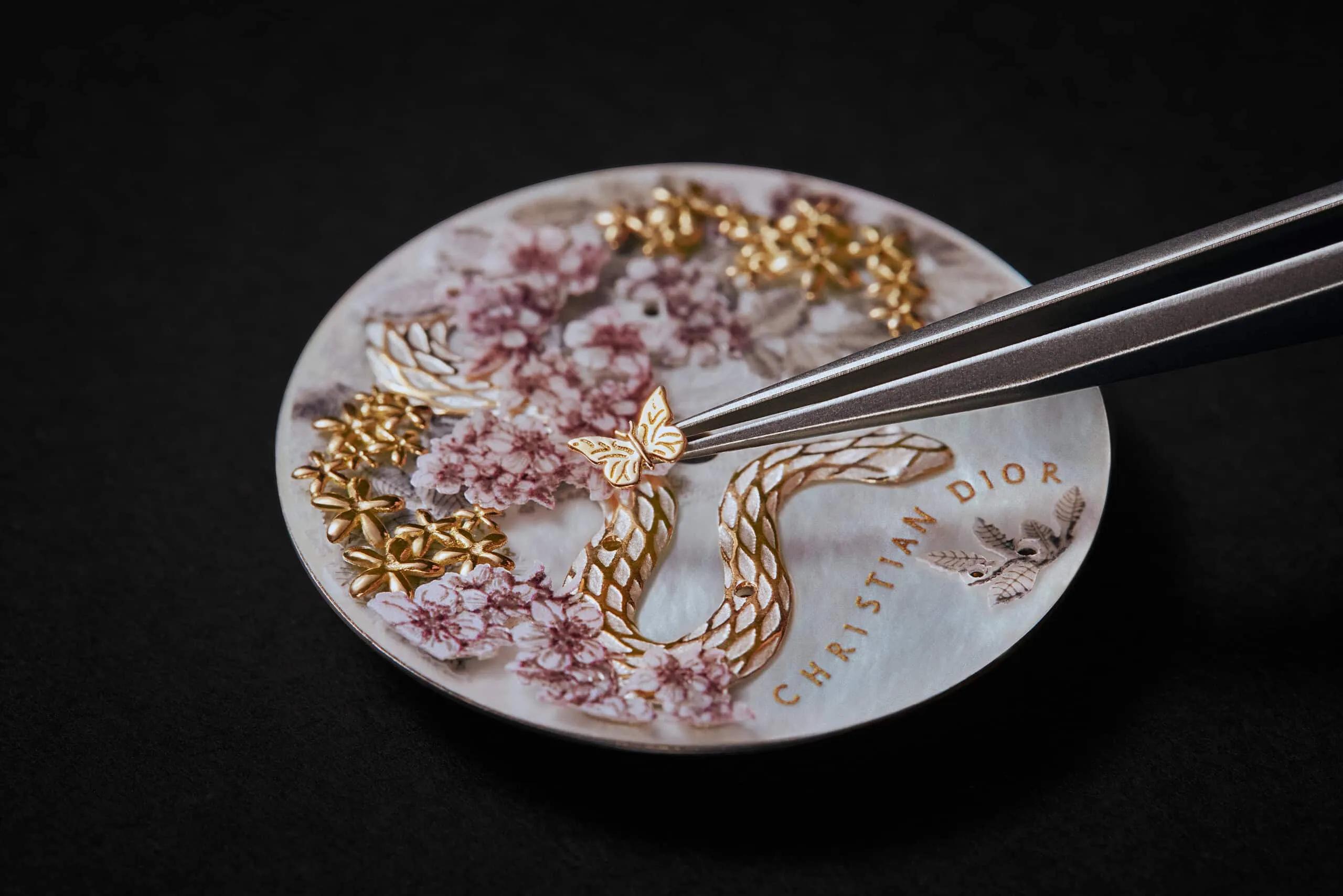Miniature details, including golden butterflies, adorn the decorative dial of the Dior Grand Soir Year of the Snake watch