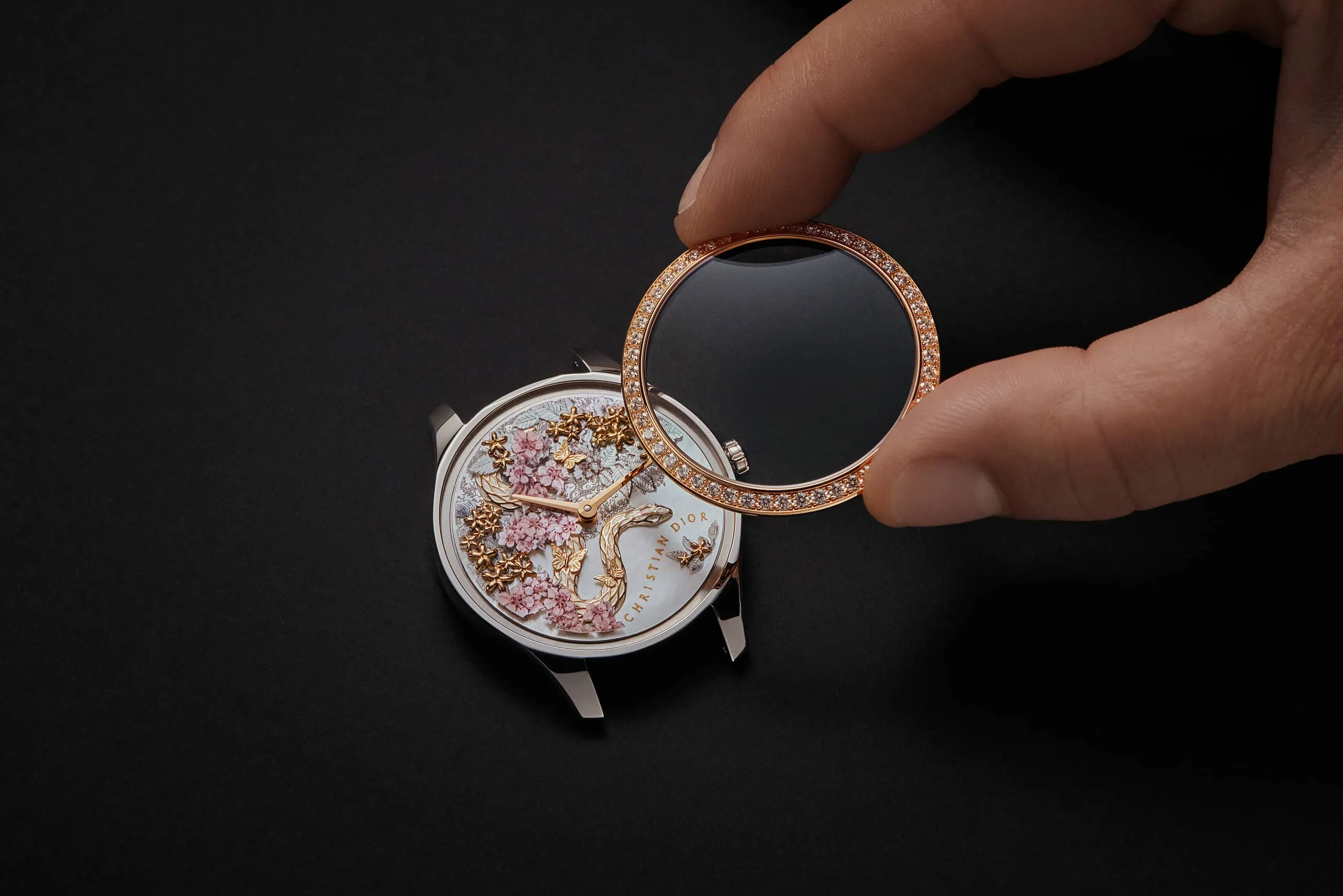 Adding the finishing touches - a diamon-set bezel - to the Dior Grand Soir Year of the Snake watch