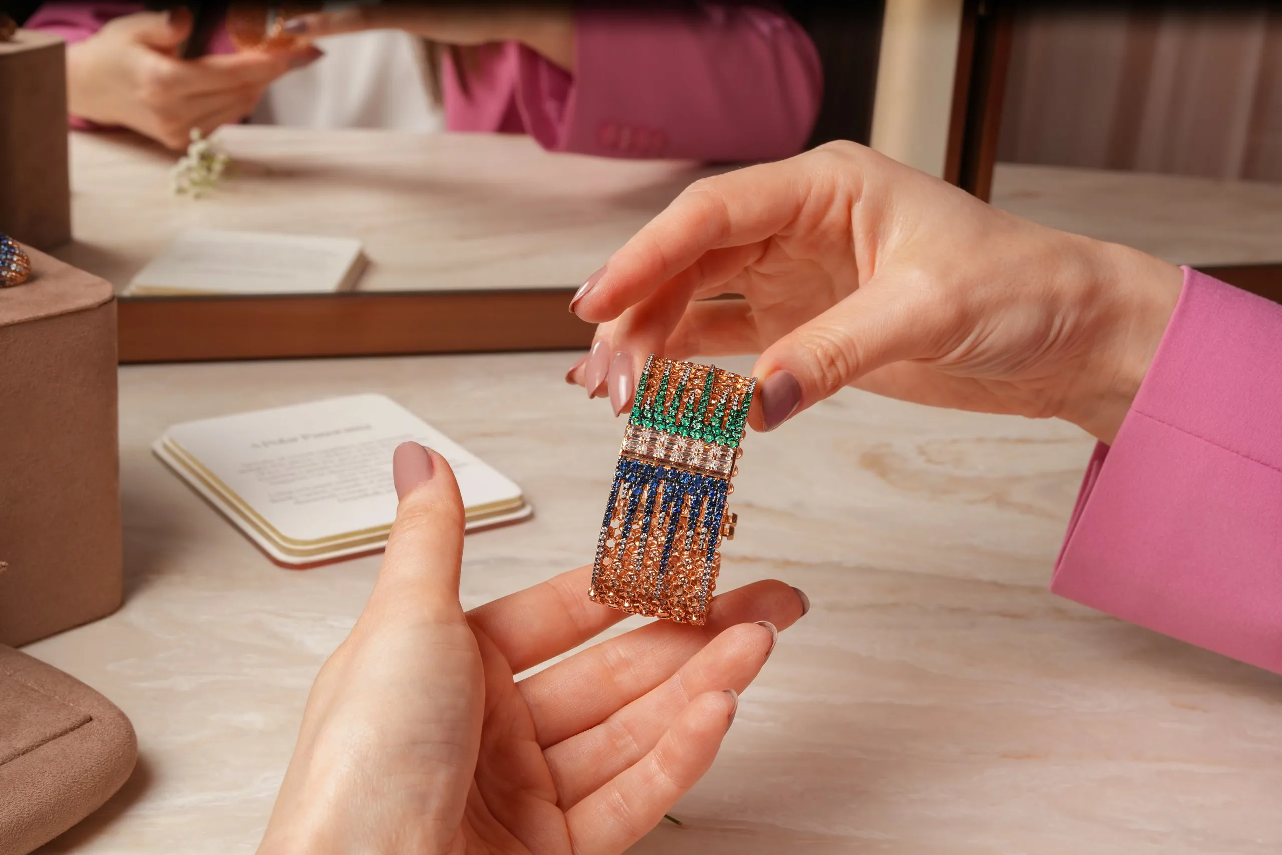 A bracelet from the Zoya Beyond collection with round-cut emeralds and sapphires and baguette-cut diamonds