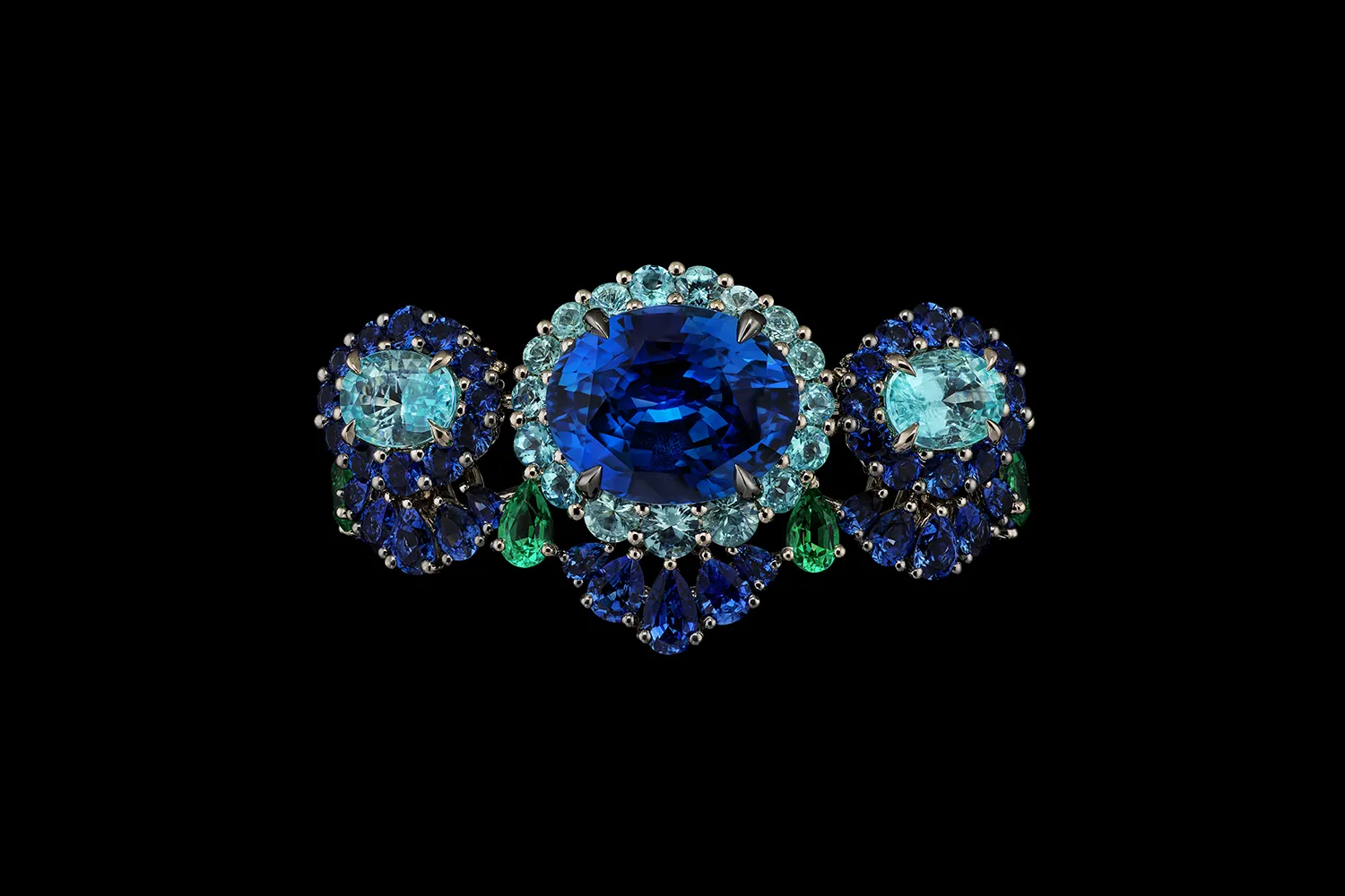A creation from the Diorexquis High Jewellery collection with a palette of deep blue, sky blue and green gemstones in round, pear and oval shapes 