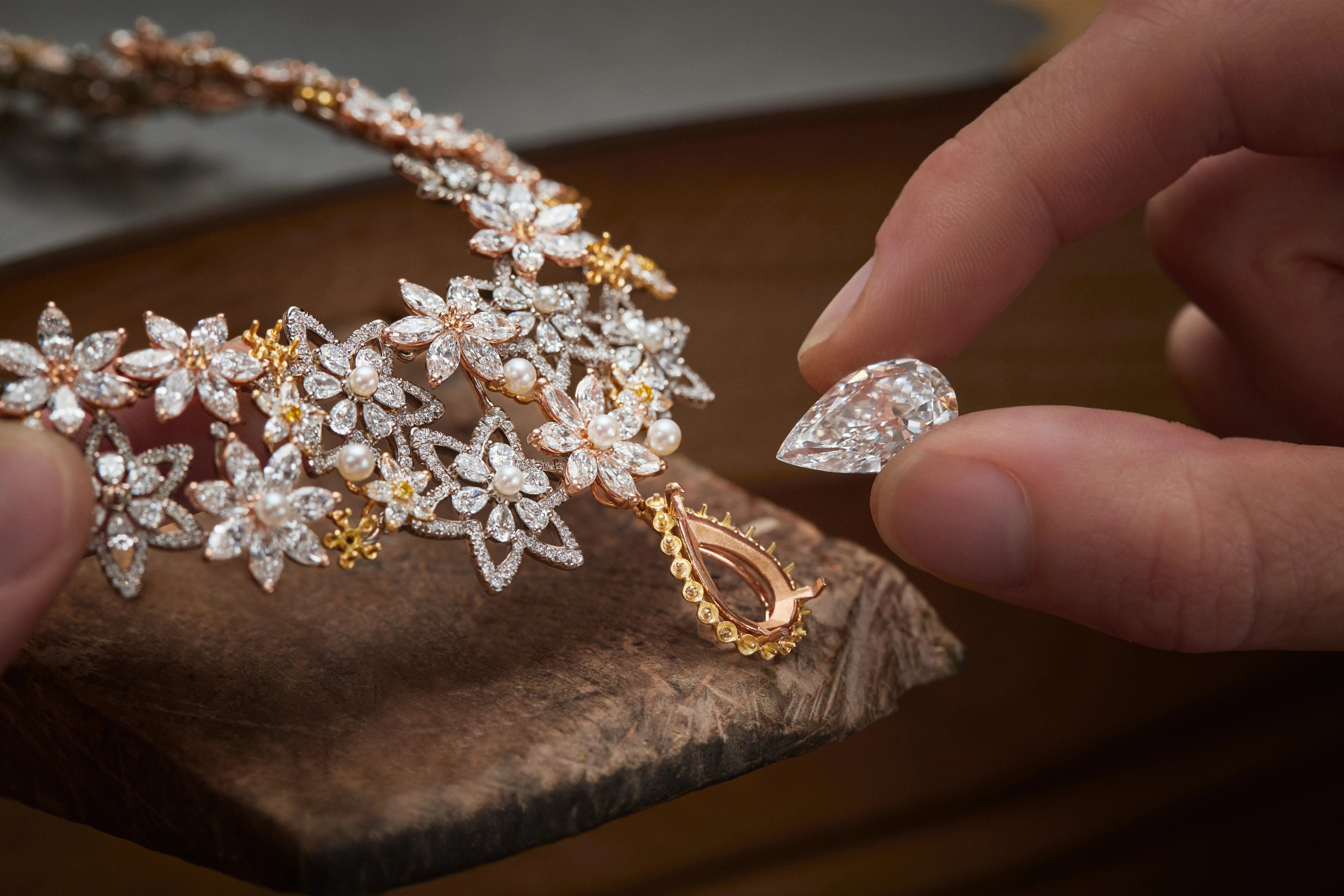 A signature necklace from the Dior Milly Dentelle High Jewellery collection is set with a large pear-shaped diamond drop, surrounded by further diamonds and micro-pearls 