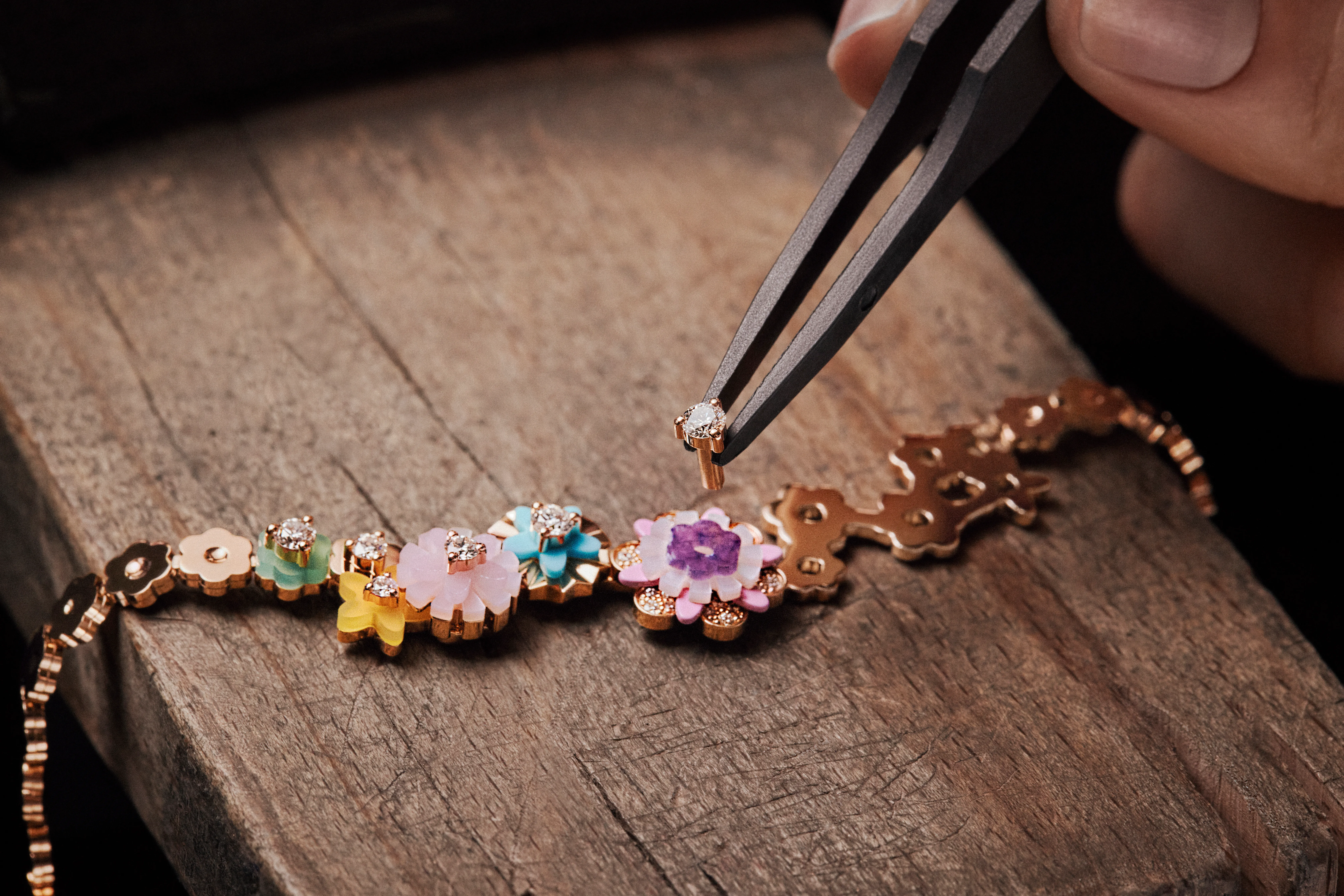 The making of the Dior Diorigami necklace, showcasing the intricate stone setting