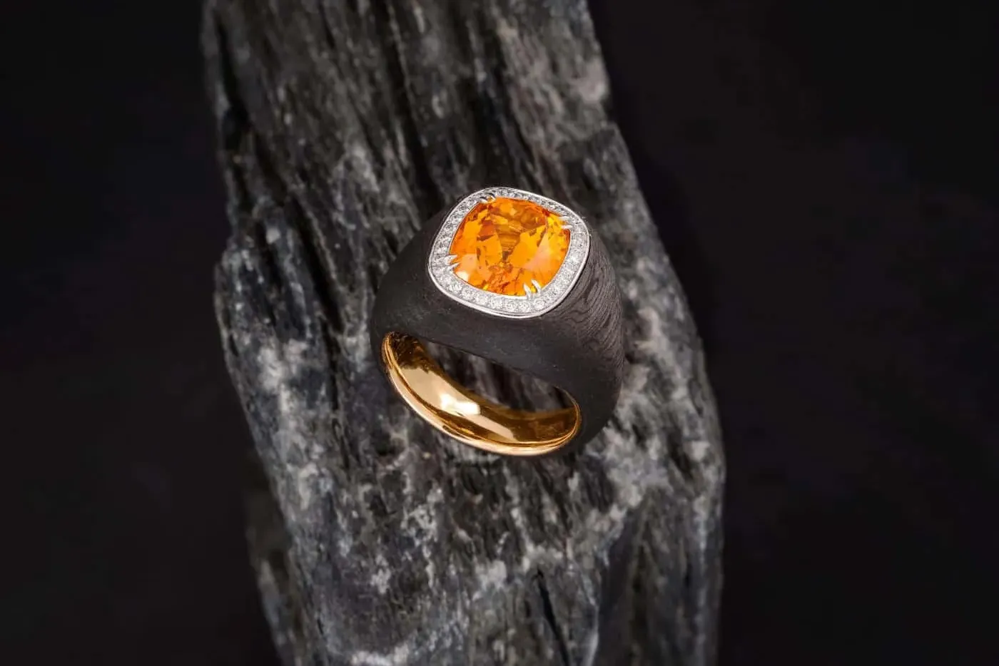 <p>Doris Hangartner mandarin garnet and carbon ring with diamonds in 18ct rose gold</p>

