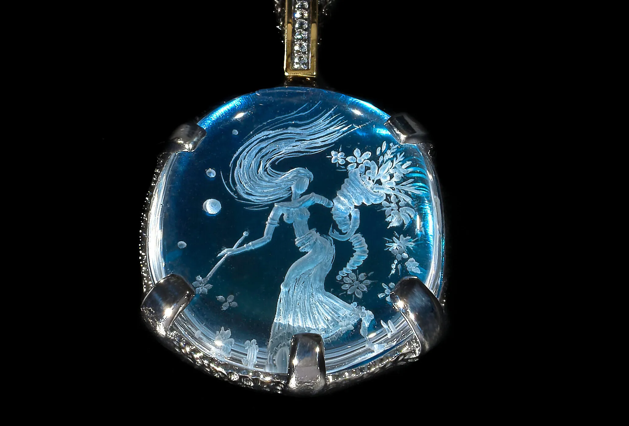 A pendant demonstrating the Greek glyptic arts with rock crystal and sky blue topaz by Eros-Psyche 