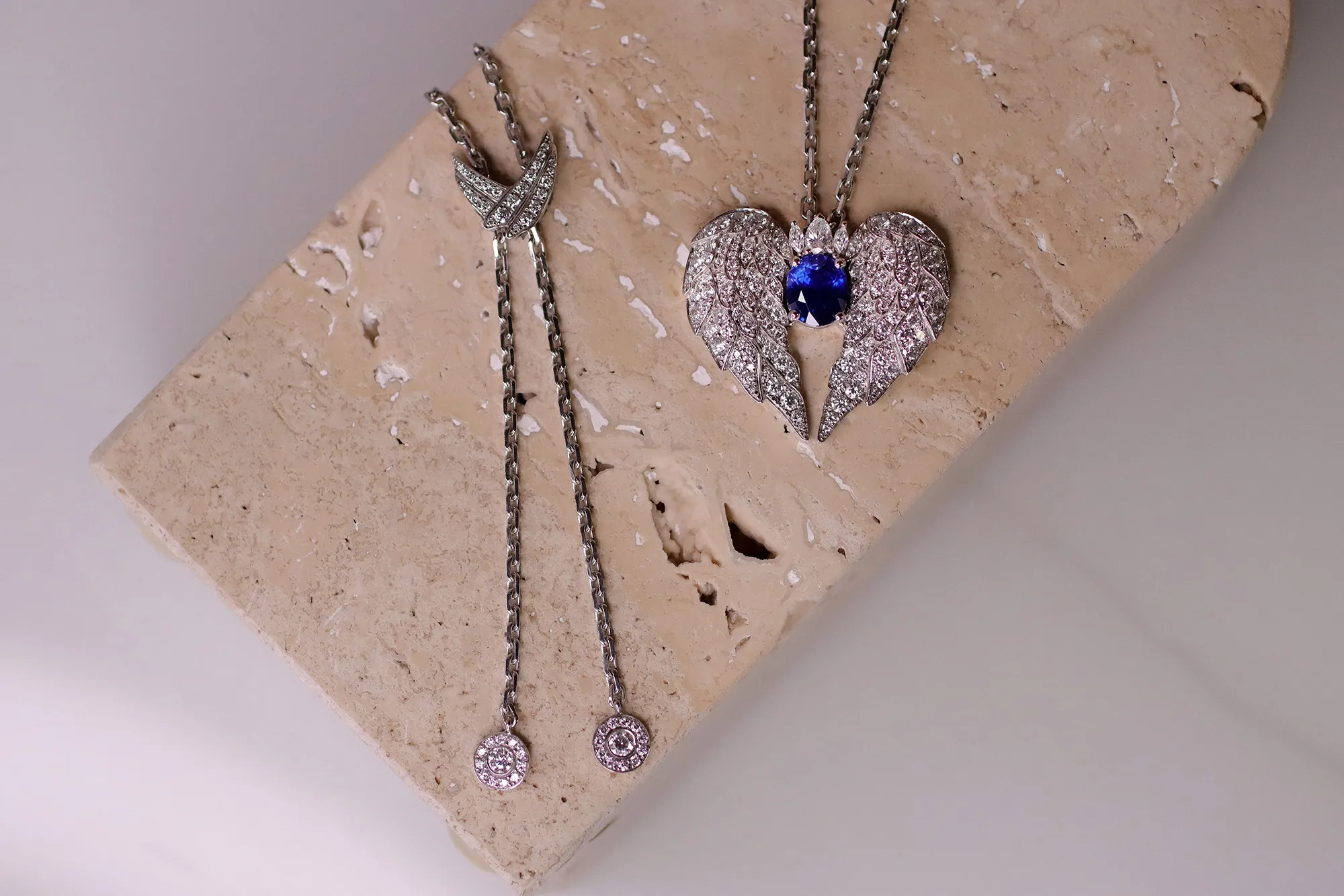 Katerina Perez’s bespoke piece by El'eeté Jewellery features an oval-shaped sapphire and diamond pendant, as well as diamond-set wing details on the clasp