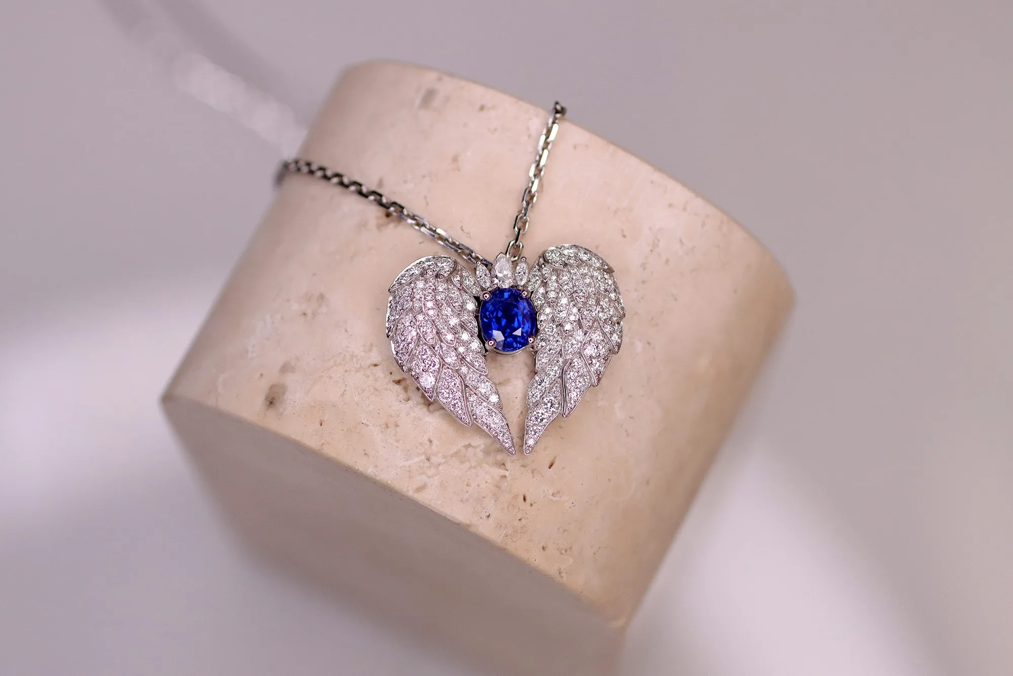 The bespoke pendant created by El'eeté Jewellery for Katerina Perez, including an oval-shaped blue sapphire, round brilliant-cut diamonds and a marquise-cut diamond crown