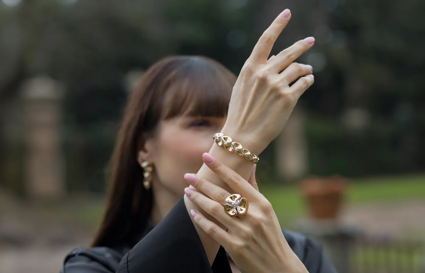 Katerina Perez wears new FerriFirenze fine jewellery pieces in 18k yellow gold from the Ninfea collection
