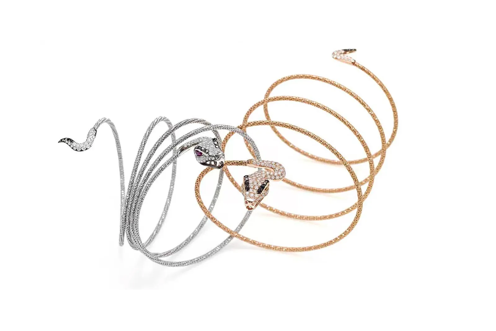<p>Giovanni Ferraris Snake bracelets in white and rose gold with diamonds</p>