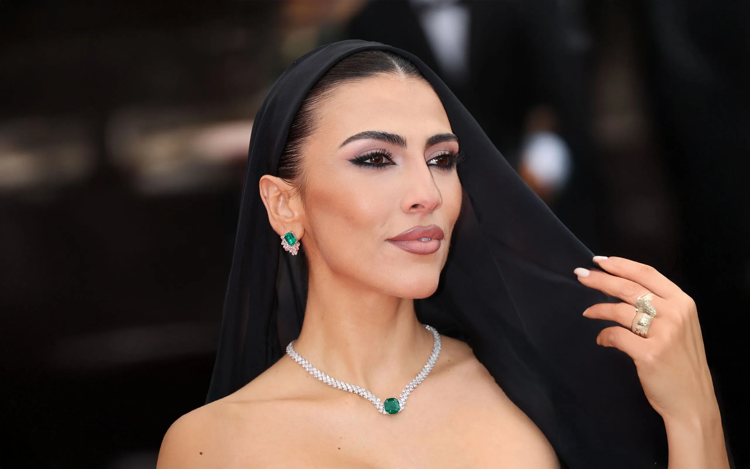 Italian television presenter and model Giulia Salemi attends the Cannes Film Festival 2025 wearing an emerald and diamond necklace by Chopard

