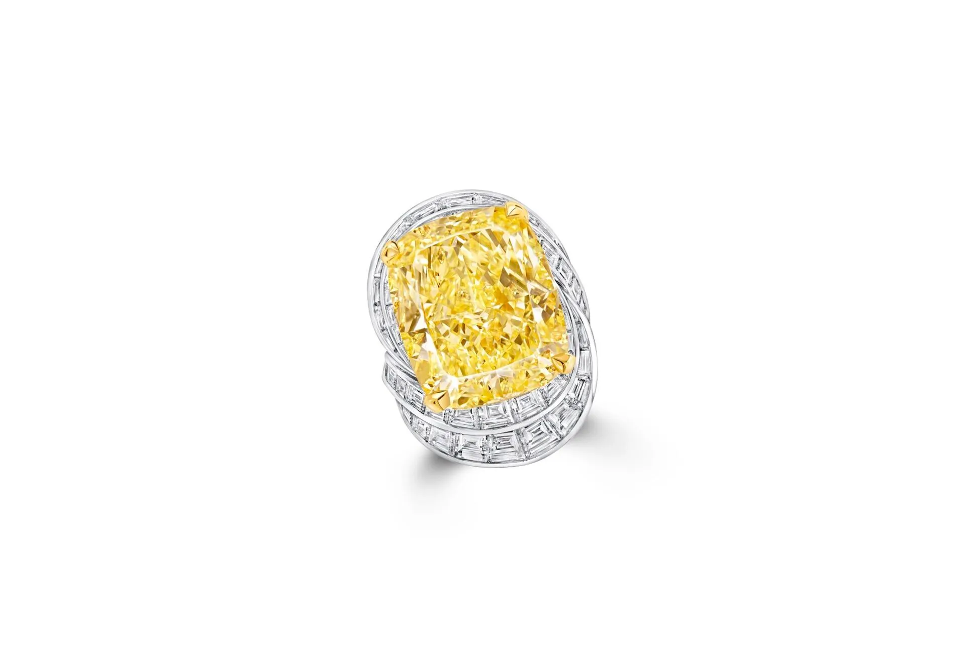 Together with this 25.55 carat Fancy Intense Yellow cushion cut diamond ring, also by Graff