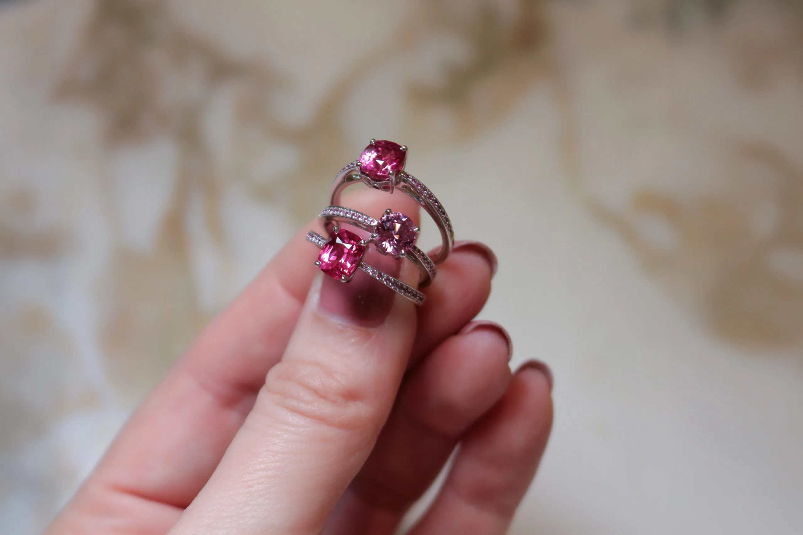 Katerina Perez takes a closer look at spinel solitaire rings from the House of Gübelin that are available in shades of pink and red in a variety of shapes