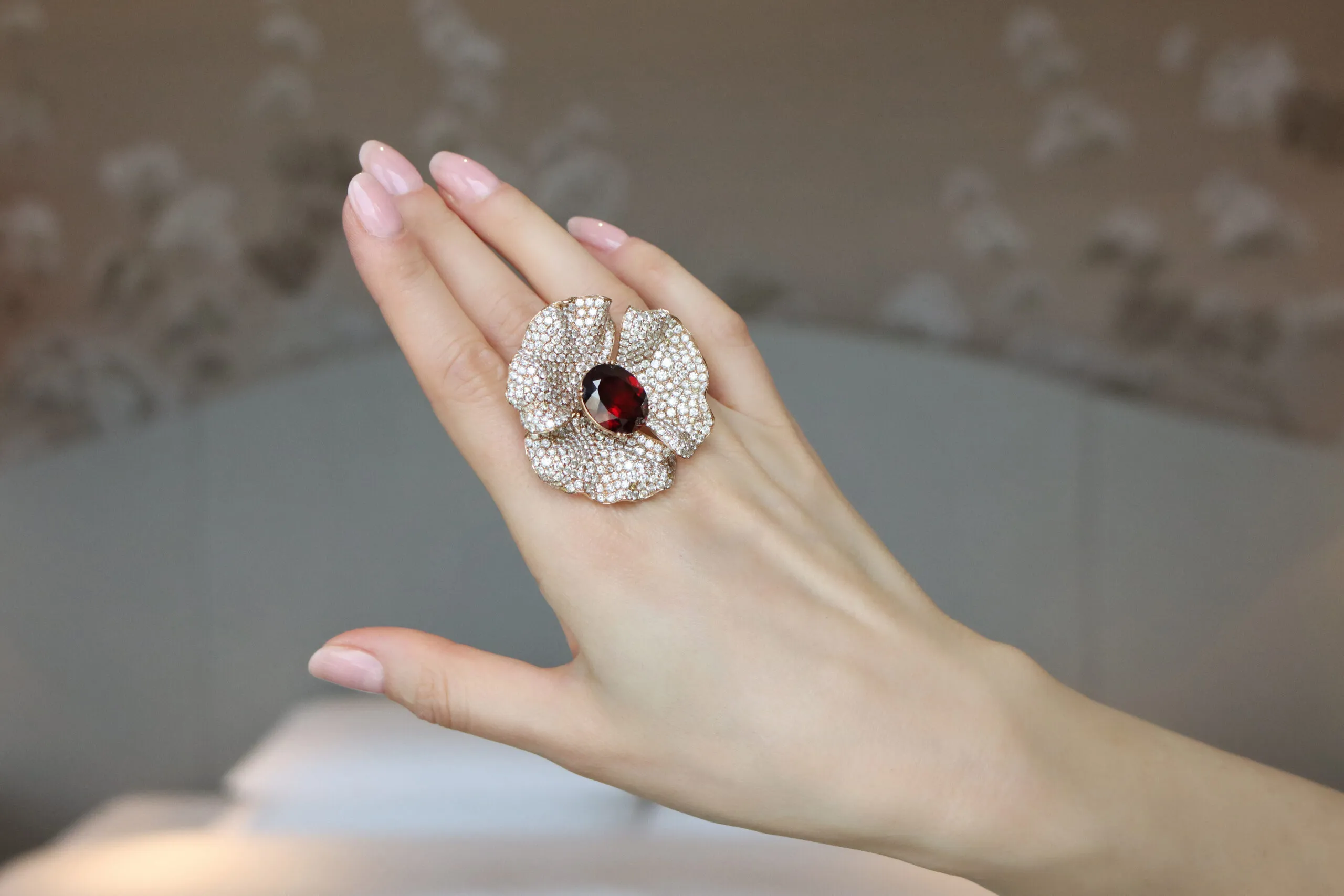 Narcisa Pheres Diamond Flower ring with 13.22 carats of diamonds and a 14.77-carat red garnet set in 18k gold 