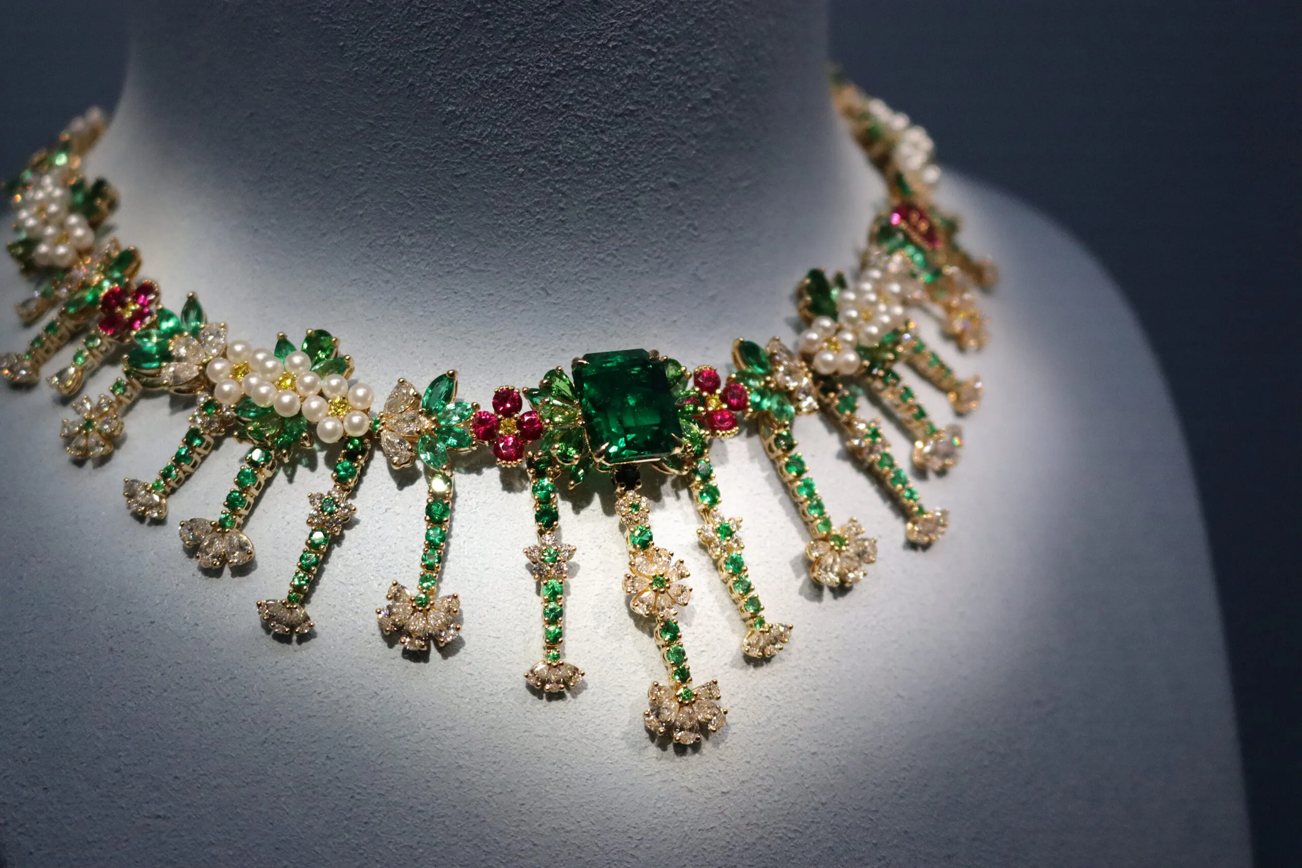 <p>A closer look at the details of the Franges de Fleurs necklace set with a 9.13-carat Zambian emerald, diamonds, pearls and ruby blossoms from the Belle Dior High Jewellery collection by Dior Joaillerie</p>