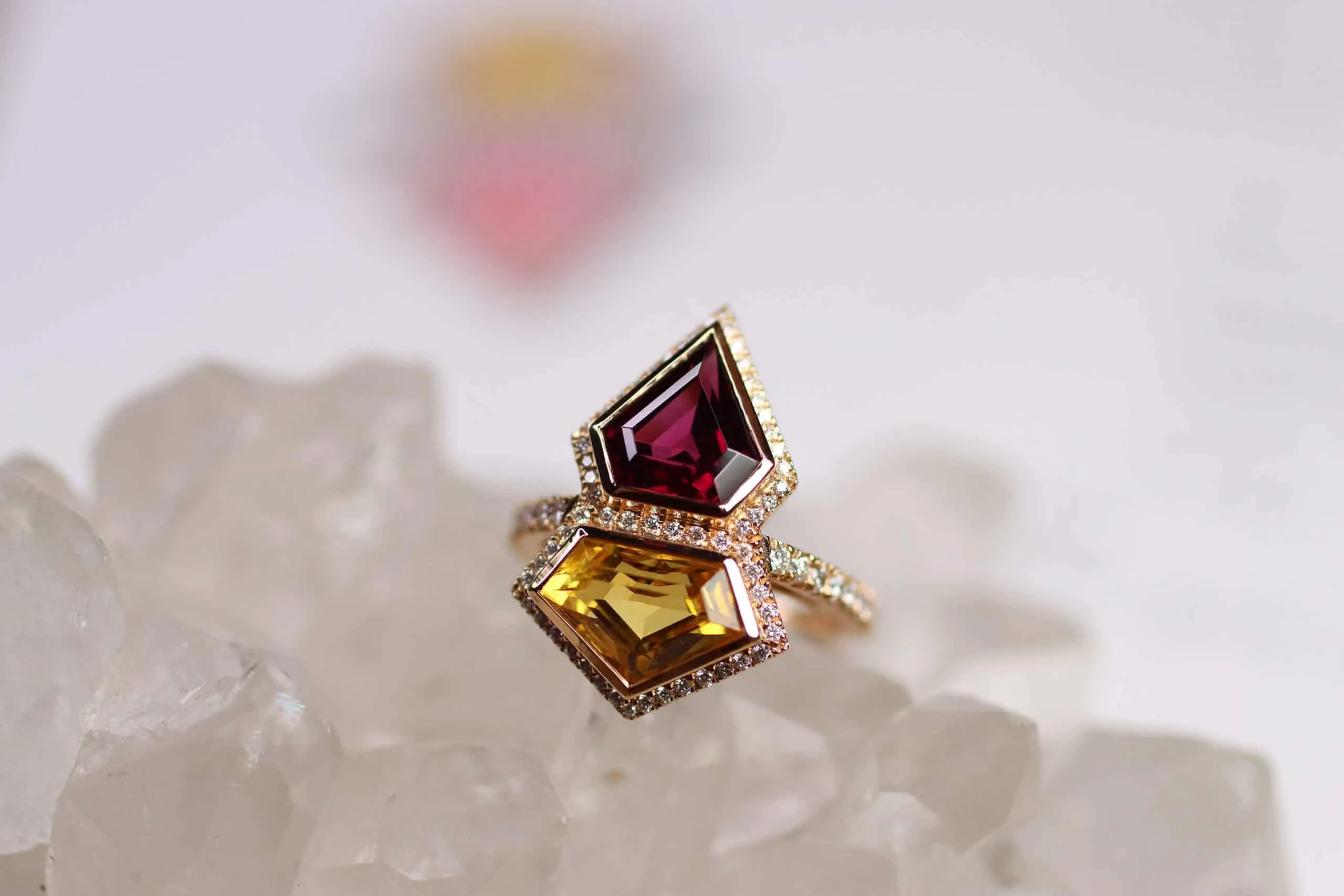 Katerina Perez's bespoke Superwoman ring by Sabine Roemer and Minehaus, set with a rhodolite garnet and a heliodor in 18k rose gold 