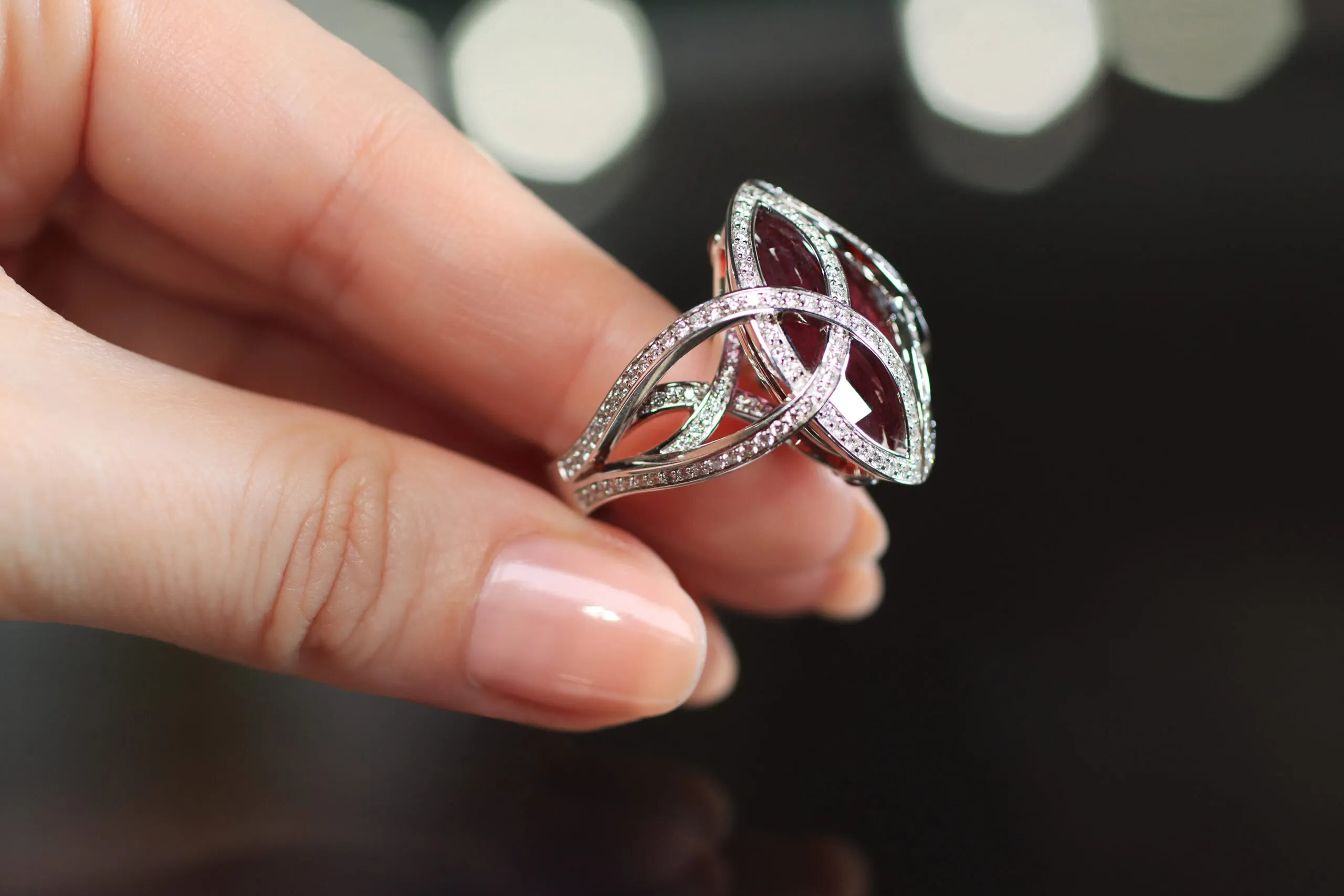 The three-dimensional side profile of the Passion ring by Elena Semy Jewellery, set with 188 diamonds totalling 1.4 carats and a 27.09 carat ruby in 18k white gold 