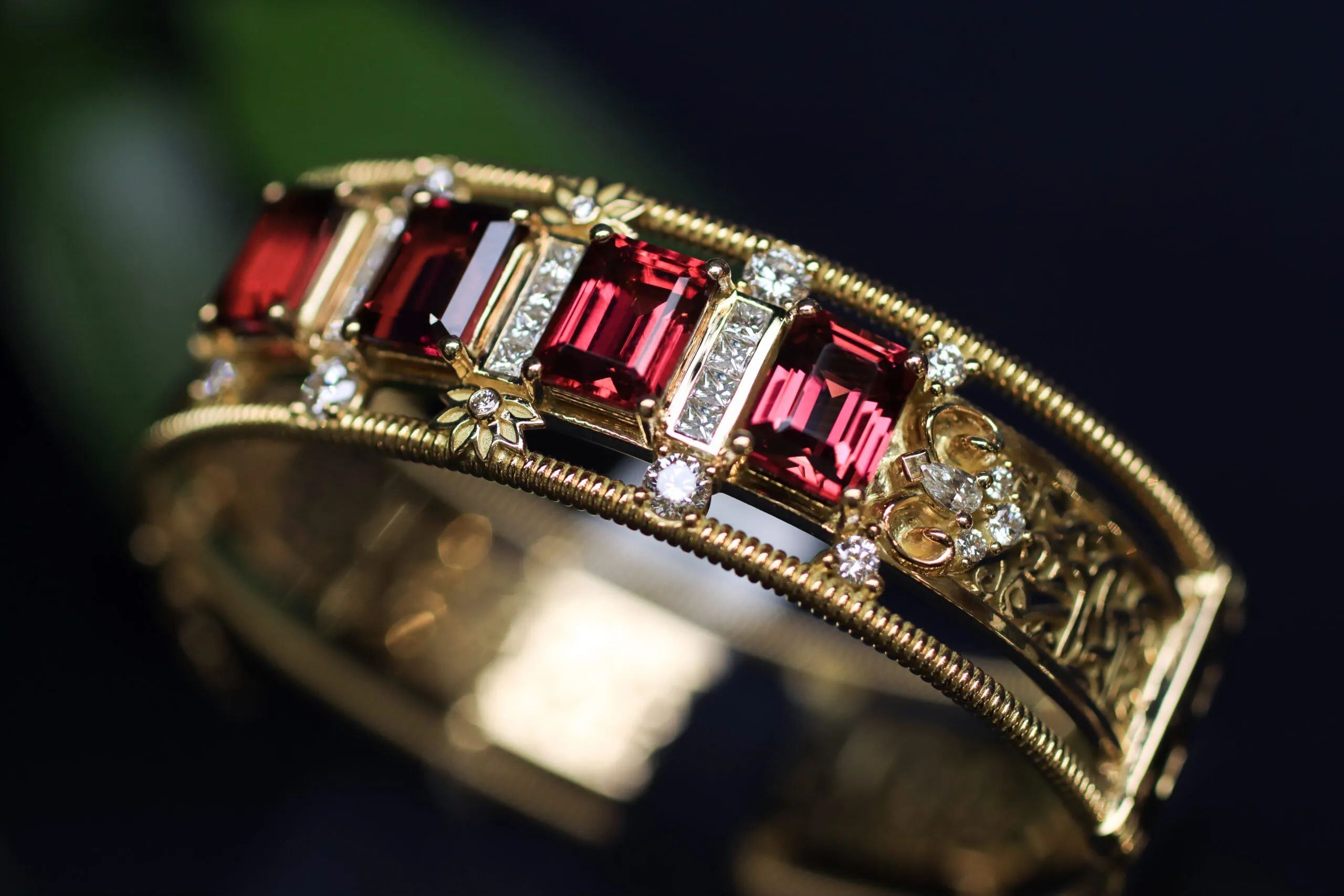 A closer look at the emerlad-cut rubellites, floral details and fancy-cut diamonds in the Azza Fahmy Art Deco Calligraphy bangle from the second chapter of the Tales of the Nile High Jewellery collection