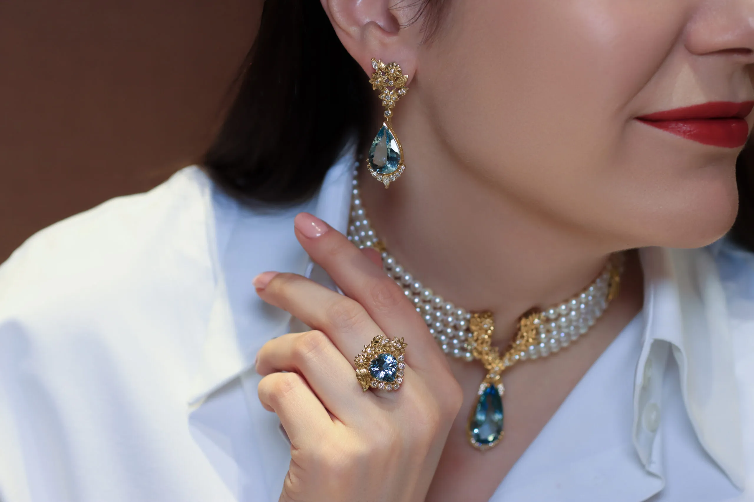 Katerina Perez wears the Azza Fahmy Garden of Light choker, earrings and a ring from the second chapter of the Tales of the Nile High Jewellery collection, set with aquamarines, Japanese Akoya pearls, and diamonds in yellow gold