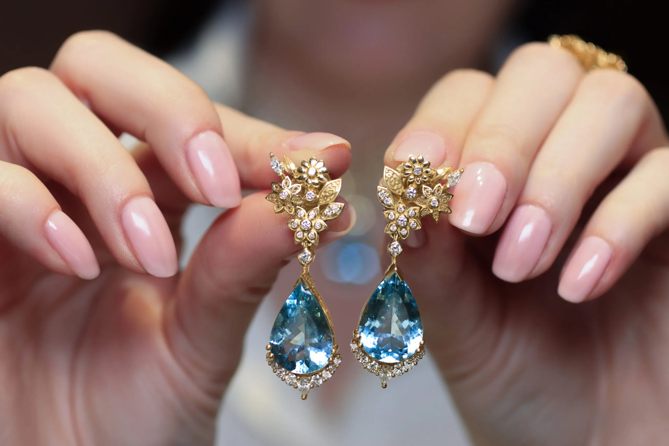 The Azza Fahmy Garden of Light earrings from the second chapter of the Tales of the Nile High Jewellery collection with pear-shaped aquamarines and diamonds in yellow gold 