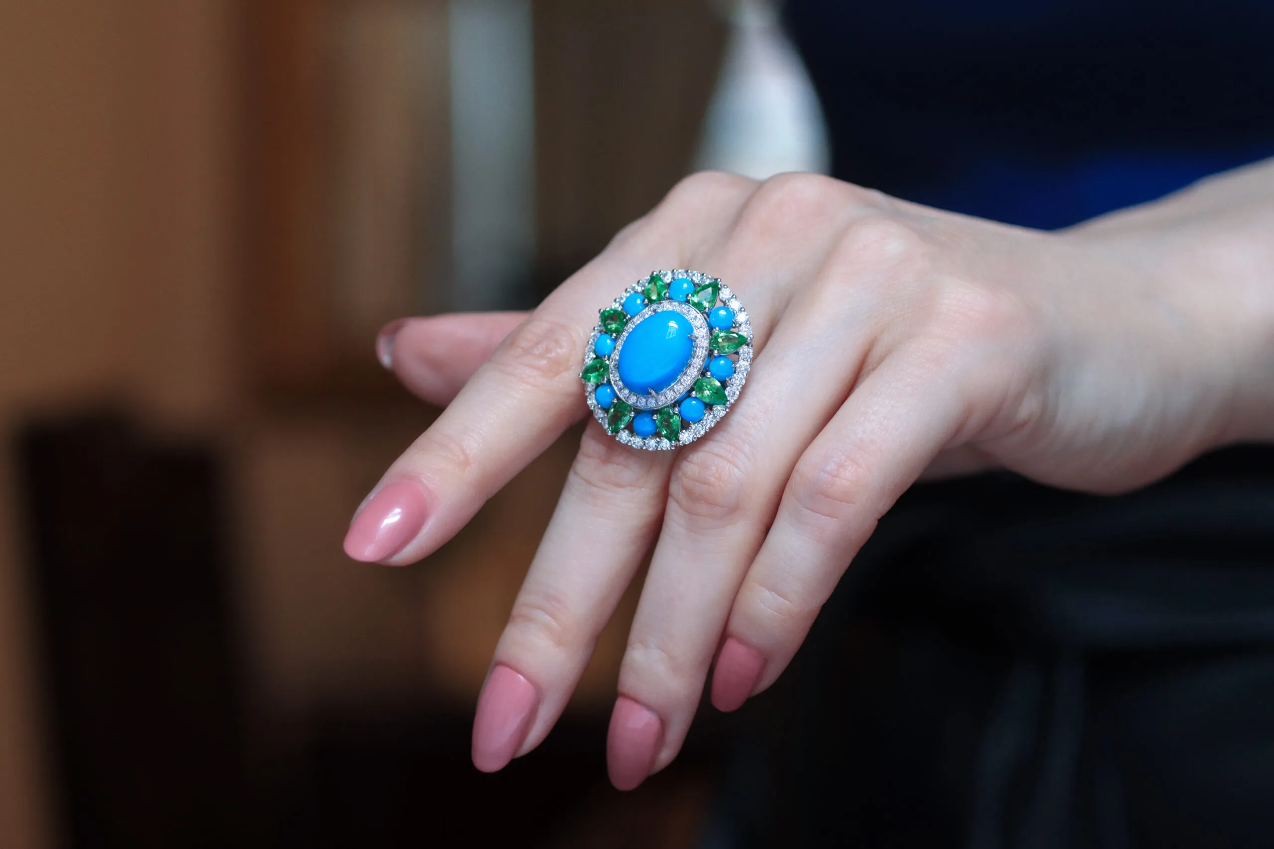 AKANO Chikaodili ring with 2.62 carats of round turquoise, 2.9 carats of tsavorite, 2.4 carats of diamonds, and 6.5 carats of oval-shaped turquoise, set in 18k gold 