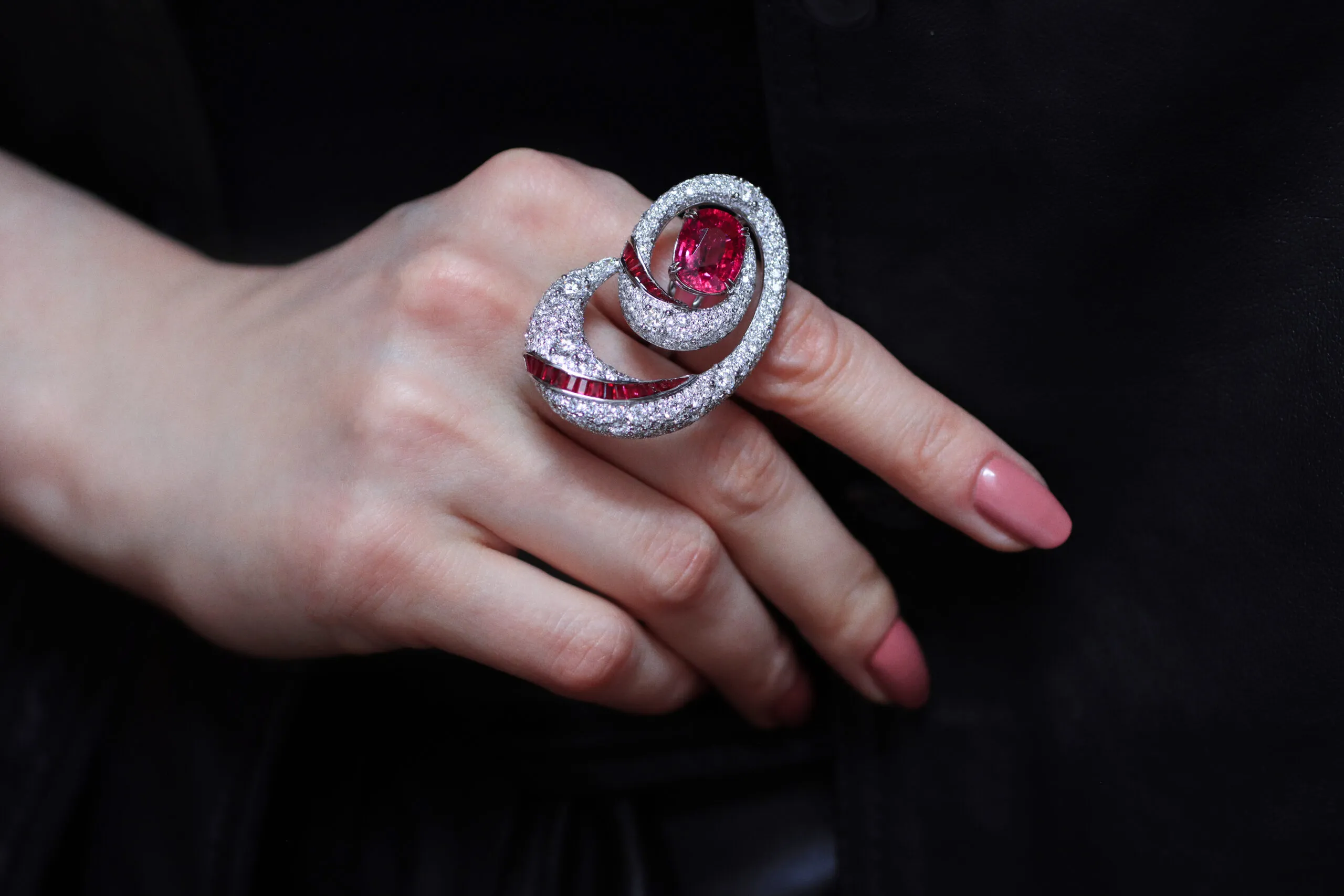The AKANO Nku ring with diamonds, channel-set rubies and an oval-shaped rubellite, set in 18k gold 