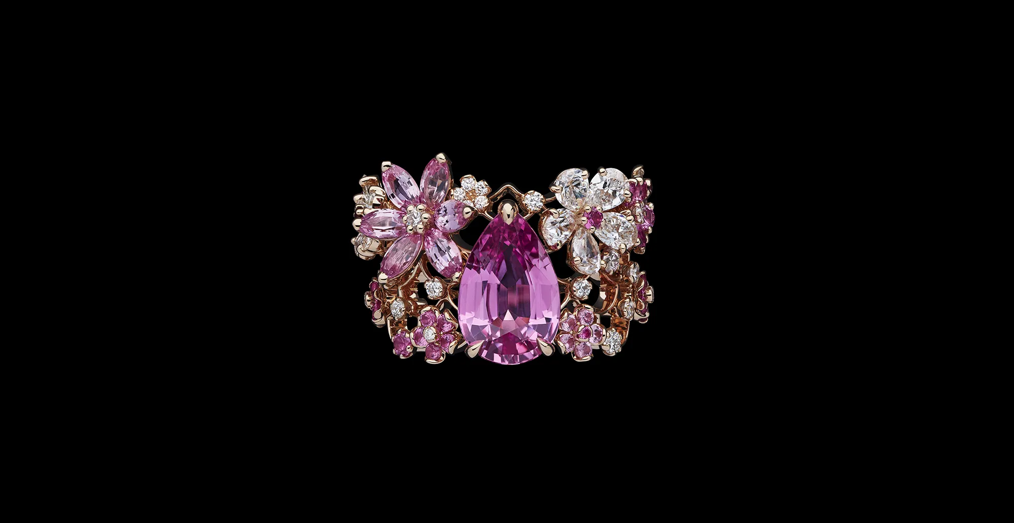 A ring with a large pear-shaped pink sapphire, marquise-shaped pink sapphires and diamonds from the Dior Milly Dentelle High Jewellery collection