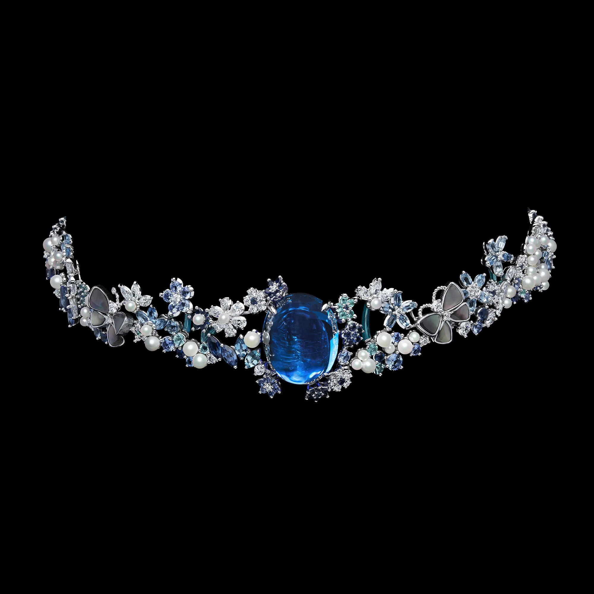 A choker necklace from the Dior Milly Dentelle High Jewellery collection with a large sapphire cabochon, mother of pearl butterflies, pearls, marquise-shaped coloured stones and fancy-cut diamonds 