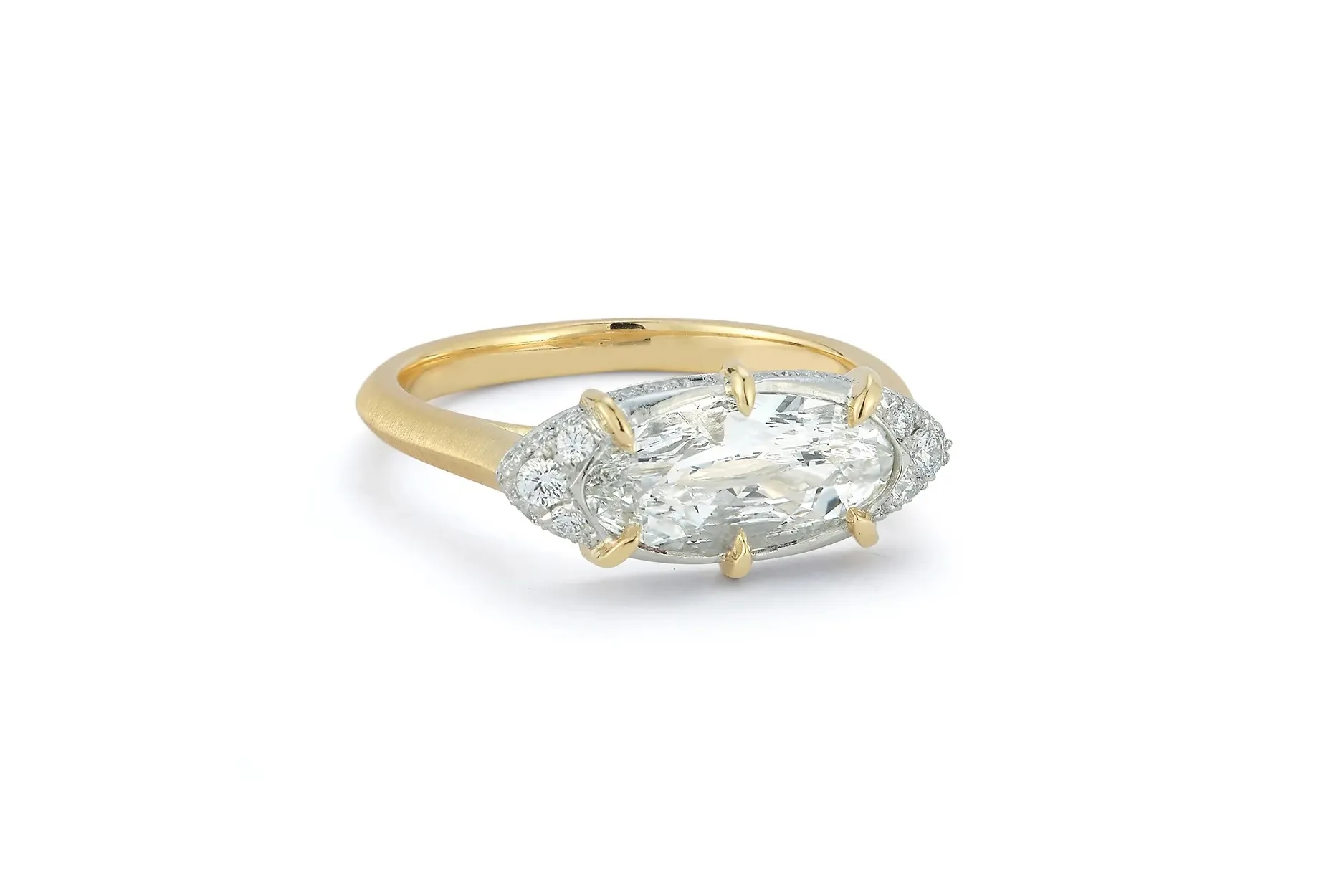 <p>Jade Trau Marium east west engagement ring with a 1.50 carat oval diamond set in 18K yellow gold.</p>
