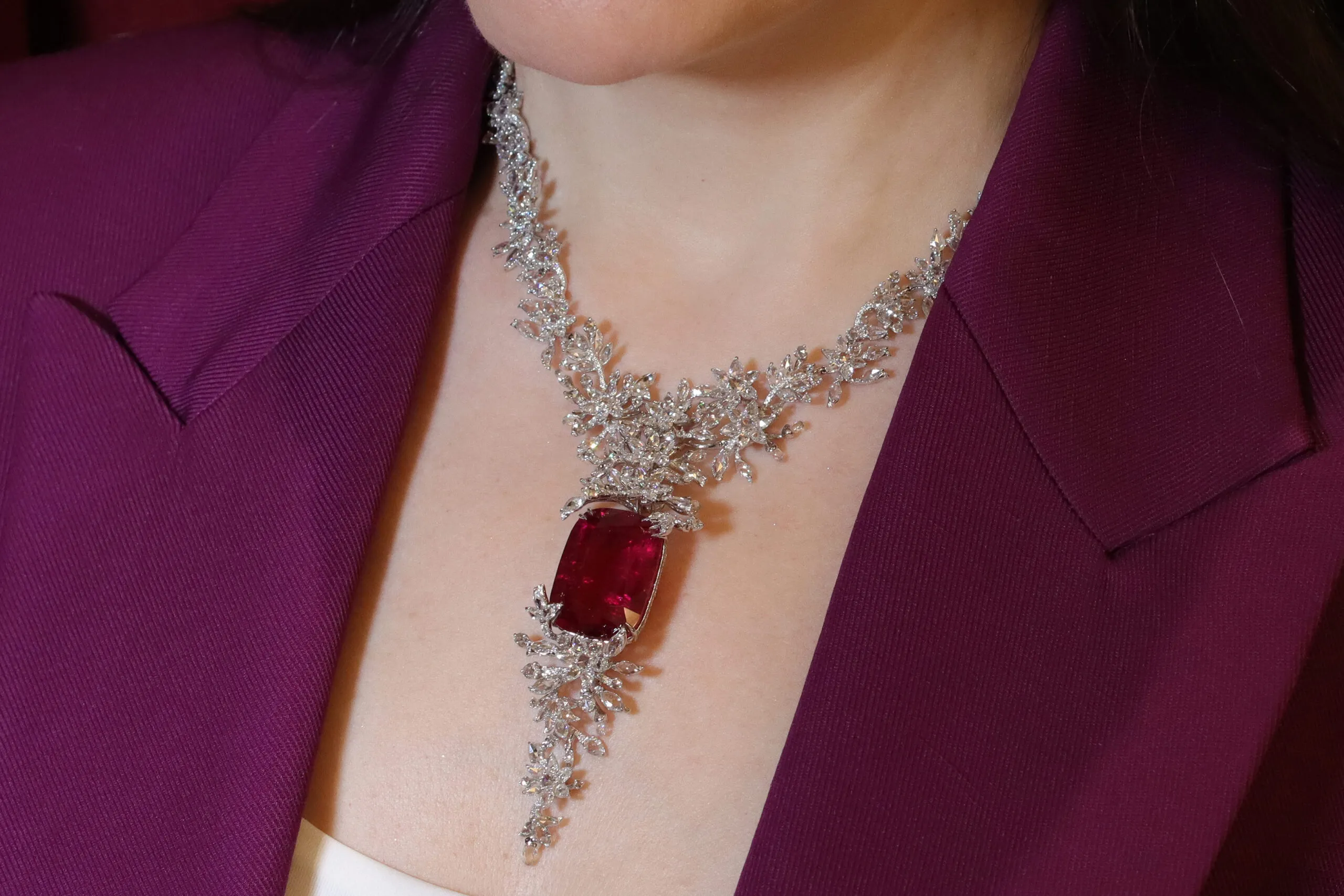 Katerina Perez wears the Jaipur Gems Rubellite Rhapsody necklace with a 45-carat fuchsia rose rubellite from Afghanistan surrounded by diamonds 