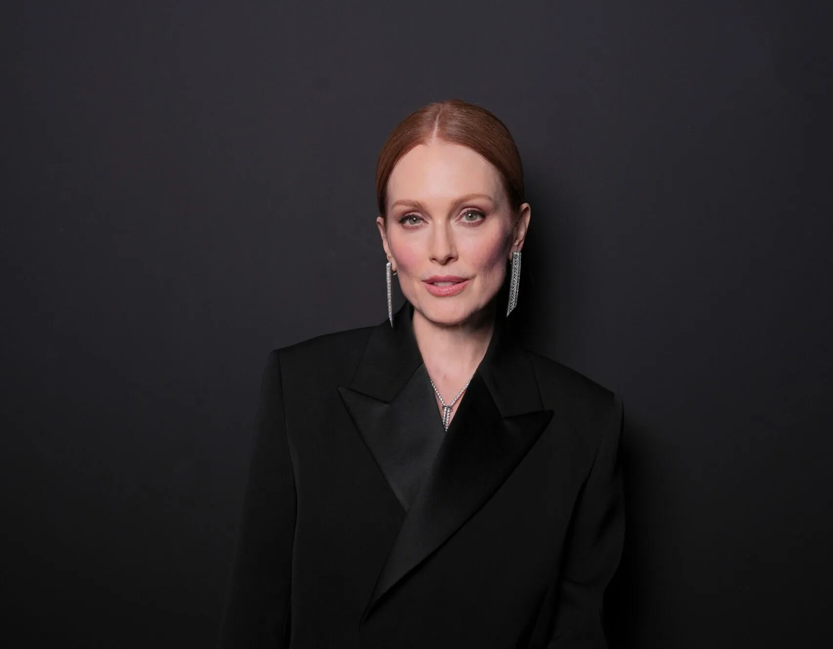 American actress Julianne Moore wears the Boucheron Quatre Radiant pendant earrings, the Pompom necklace, and the Vendôme Liseré ring at the Cannes Film Festival 2025