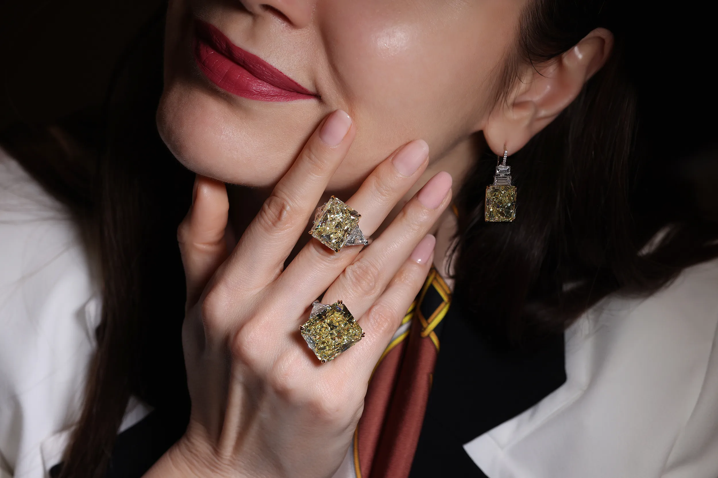 <p>The rings paired with radiant cut Fancy Intense Yellow diamond earrings of 30 carats</p>