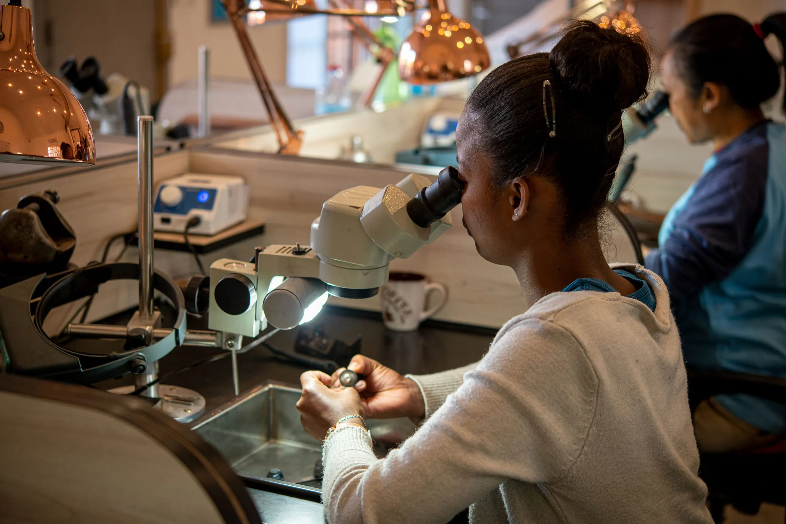 <p>Local artisans complete a final polish on fine jewellery pieces created by Morebelli in Madagascar </p>

