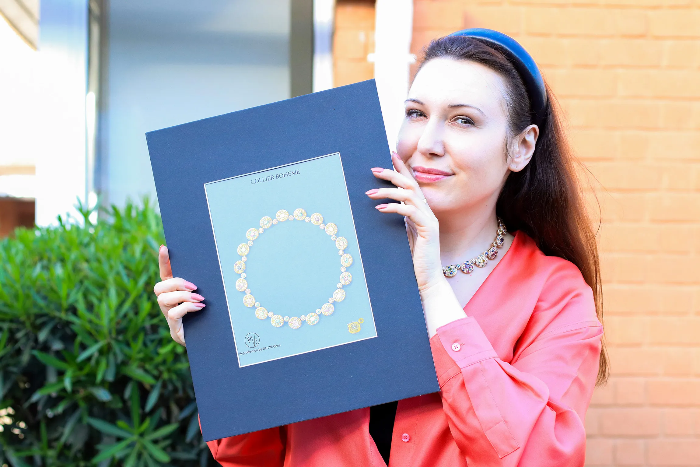 <p>Katerina Perez holds a gouache painting of the Morebelli Collier Bohème – a masterpiece necklace created to celebrate the brand&#8217;s 10th anniversary in 2022</p>

