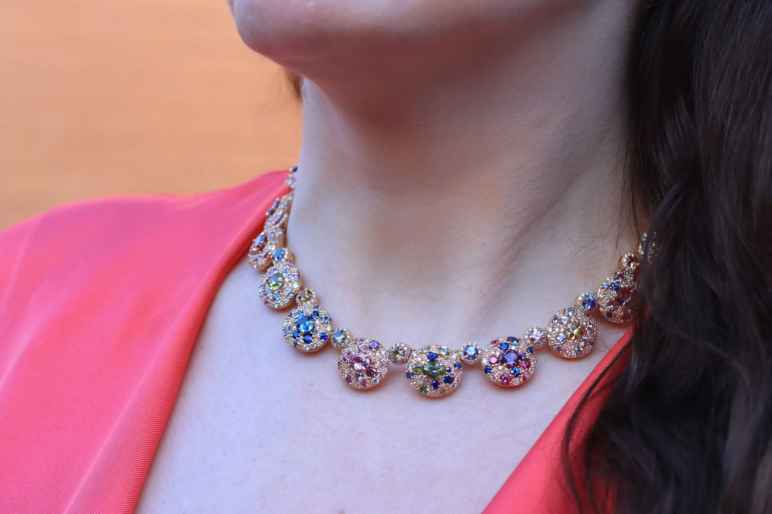 <p>Katerina Perez wears the Morebelli Collier Bohème with sapphires from Ilakaka, Madagascar, including pink, purple, blue, green and yellow gems, alongside 19 larger, unheated sapphires from the country </p>
