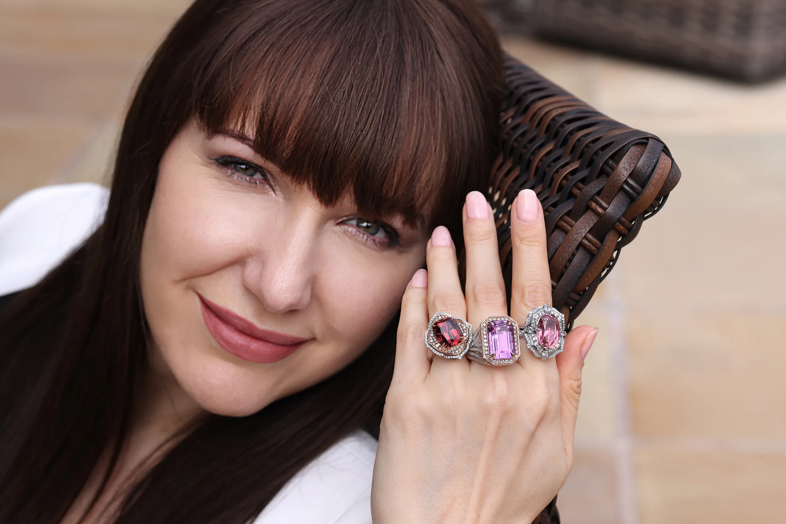 <p>A handful of Chromia’s rare and exotic gemstones: a 20.52ct emerald cut Mawi kunzite; a 9.19ct cushion cut titanium tourmaline; and a 9.42ct oval titanium tourmaline</p>