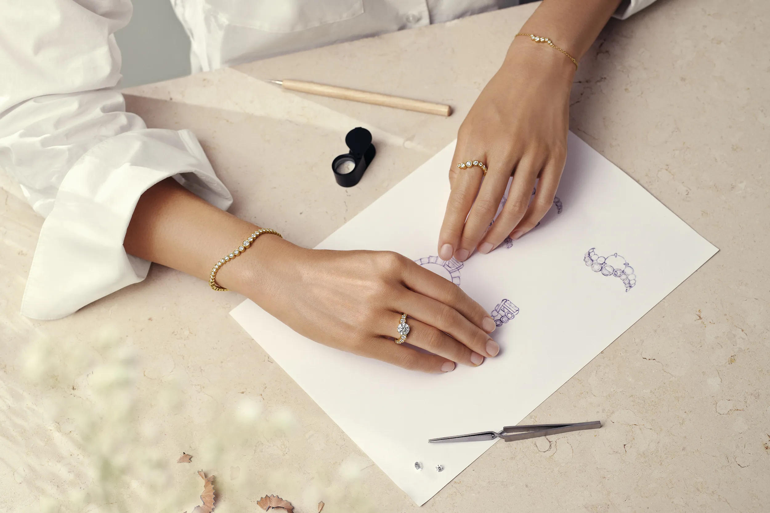 <p>A model wears pieces from the Cherituelle Ondine collection, including the Signature bangle with 3.37 carats of laboratory-grown diamonds in 18k yellow gold</p>
