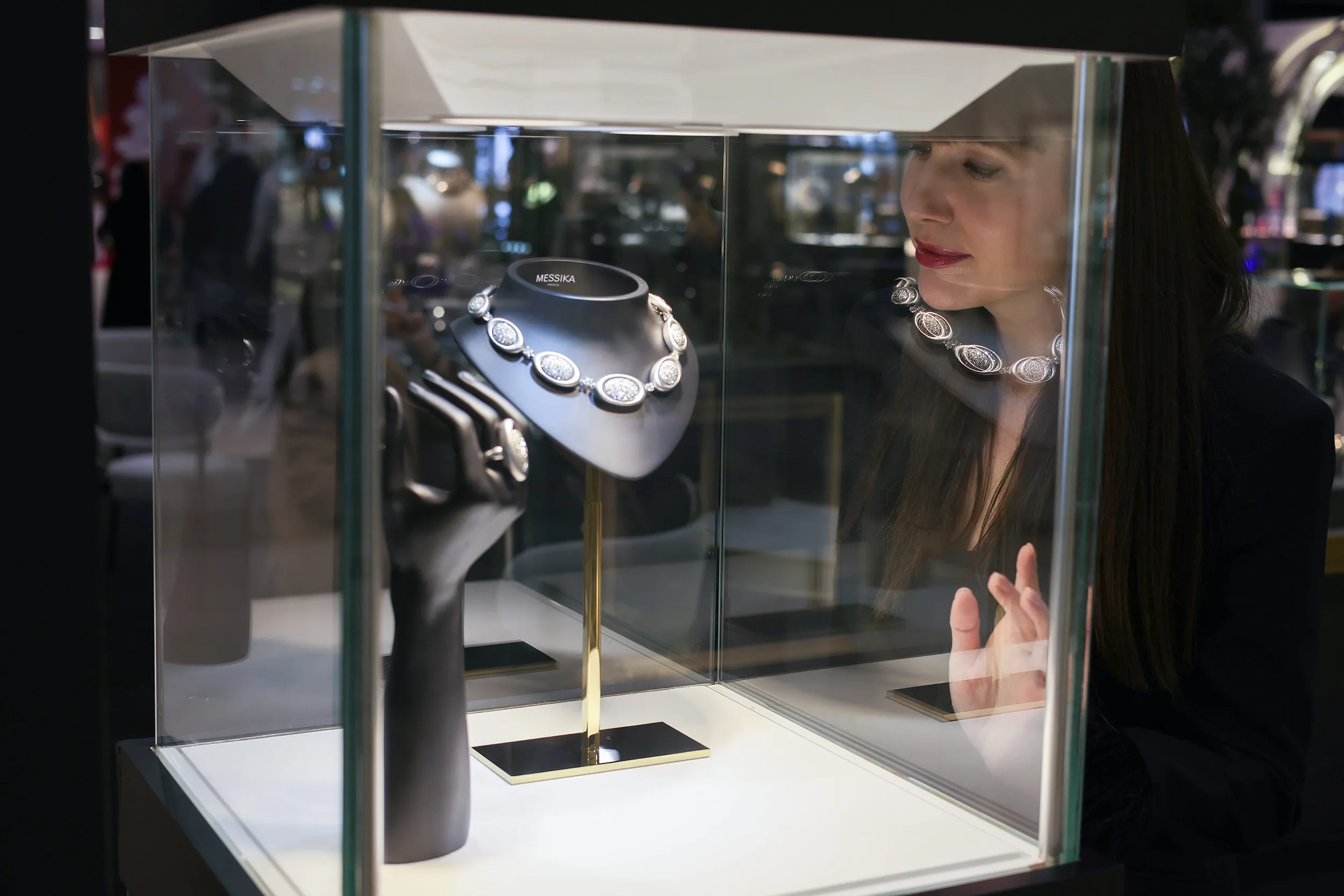 <p>Katerina admiring the Messika vitrine at Jewellery Arabia</p>