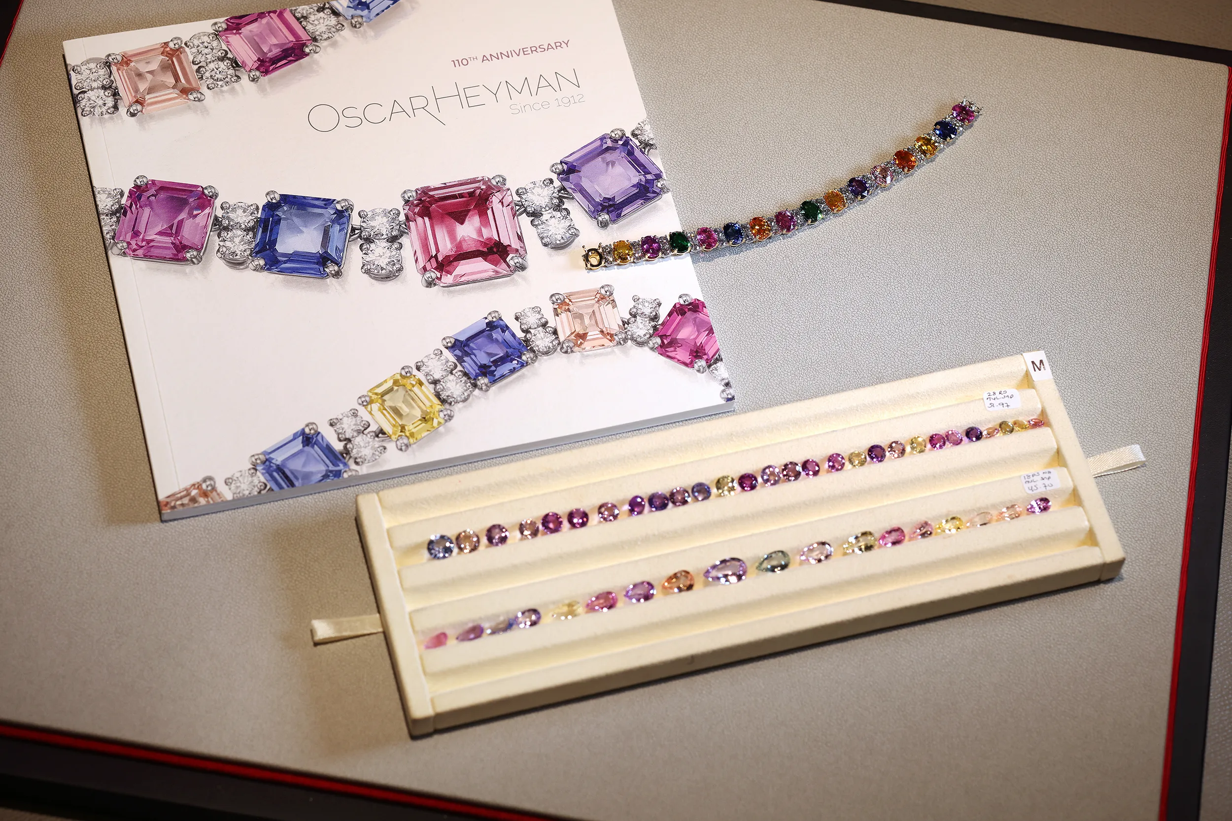 <p>A tray of loose multi-colour pastel sapphires, which will eventually find a home in an exquisite necklace or bracelet. The team can take months and even years to find the right mix of stones for any one design</p>
